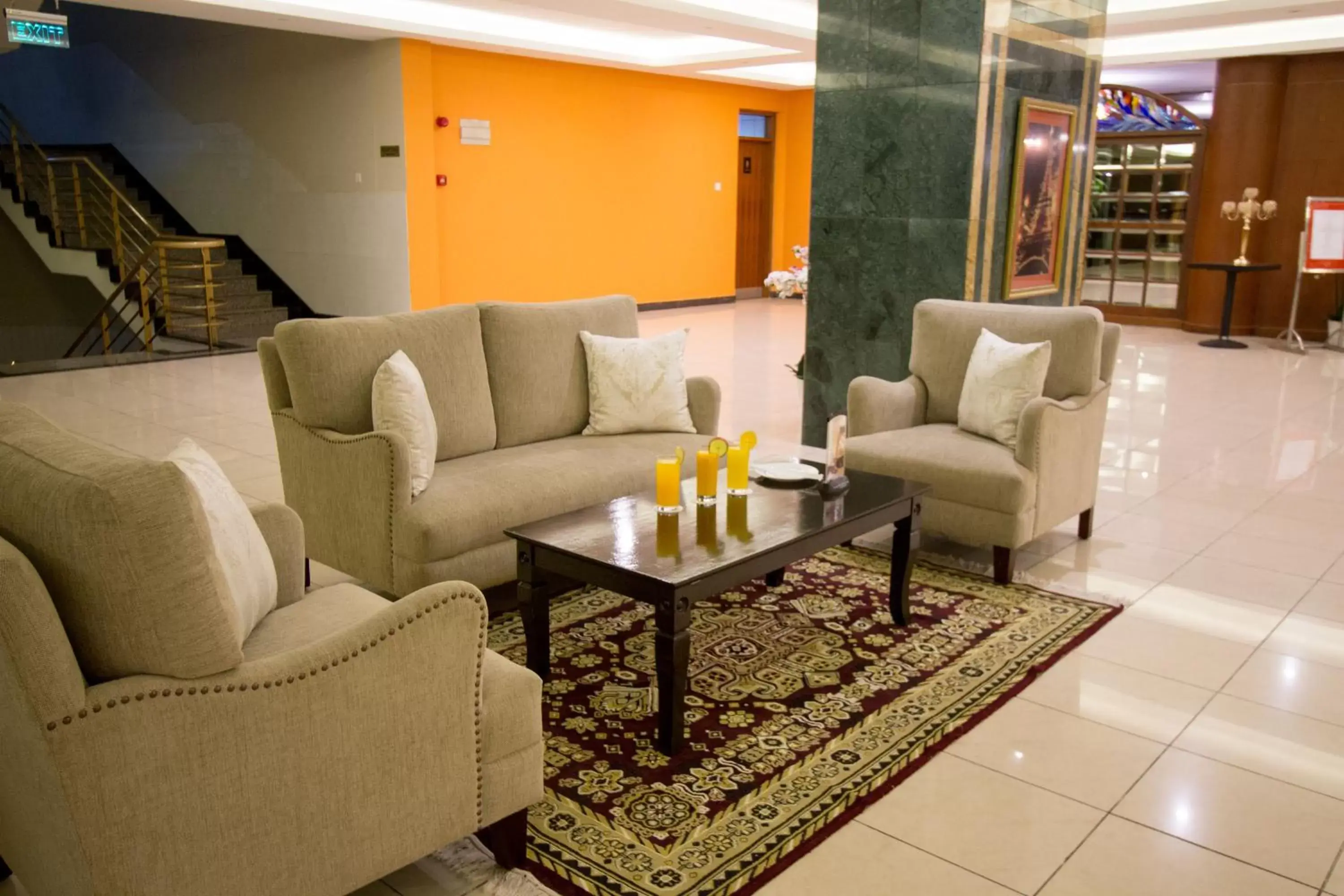 Communal lounge/ TV room, Seating Area in The Panari Hotel