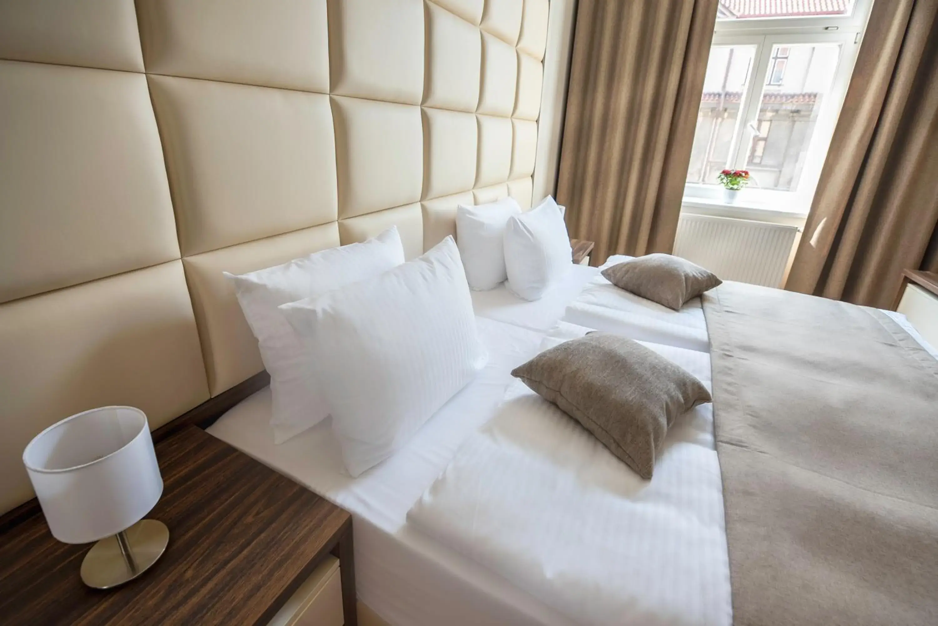 Bed in Letna Garden Suites