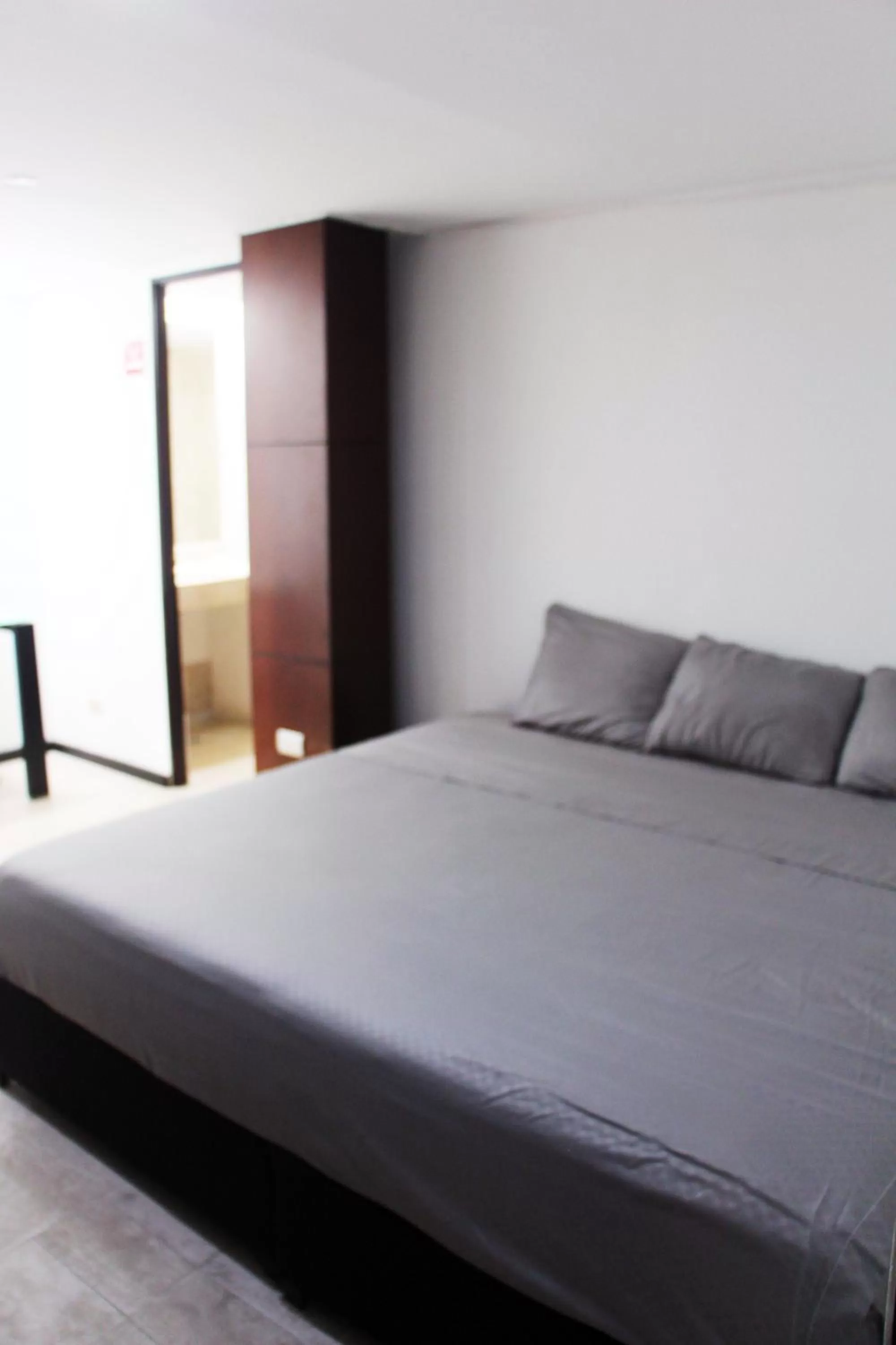 Photo of the whole room, Bed in Hotel & Hostal Casa de Luz Cancun