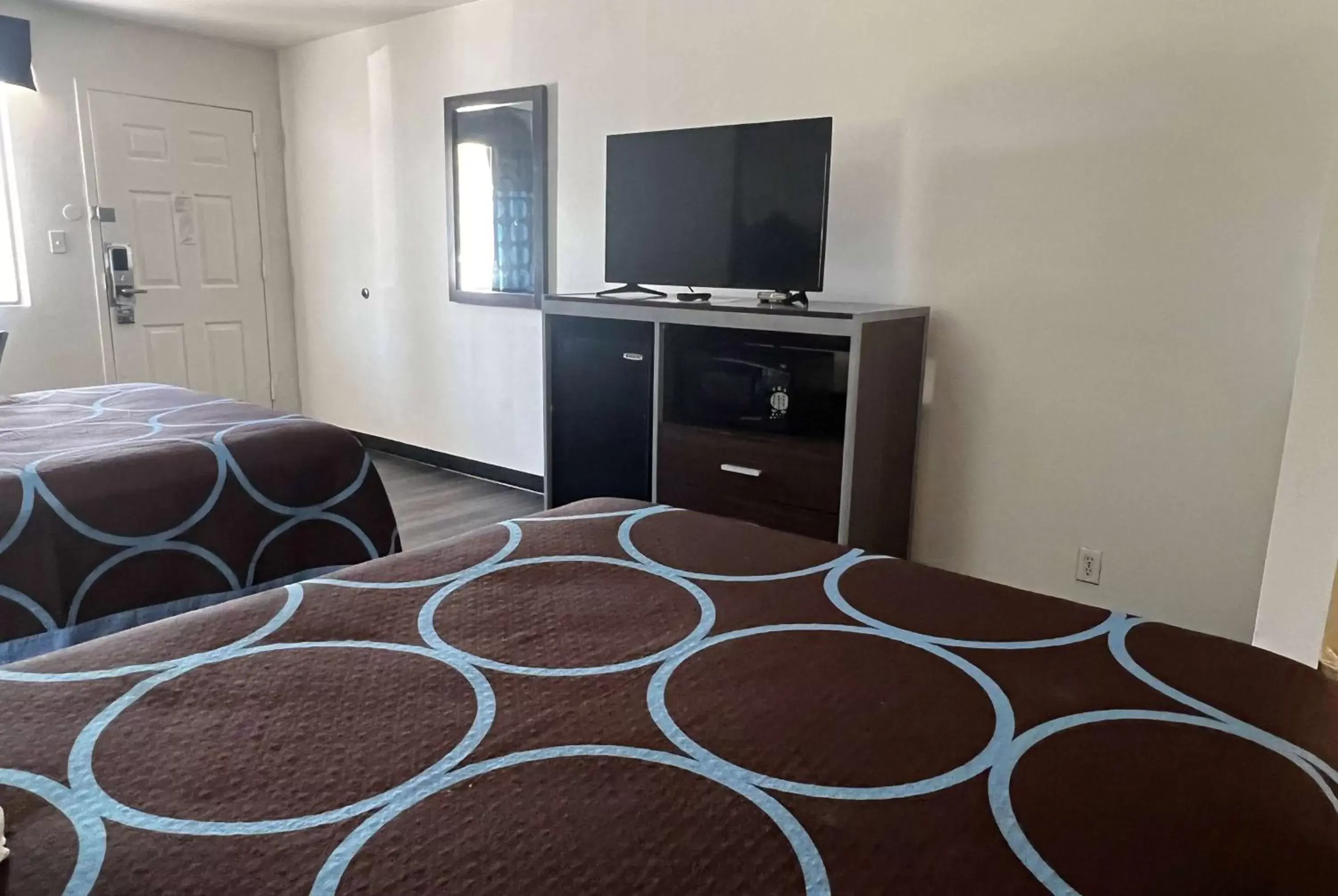 Photo of the whole room, TV/Entertainment Center in Super 8 by Wyndham Slidell