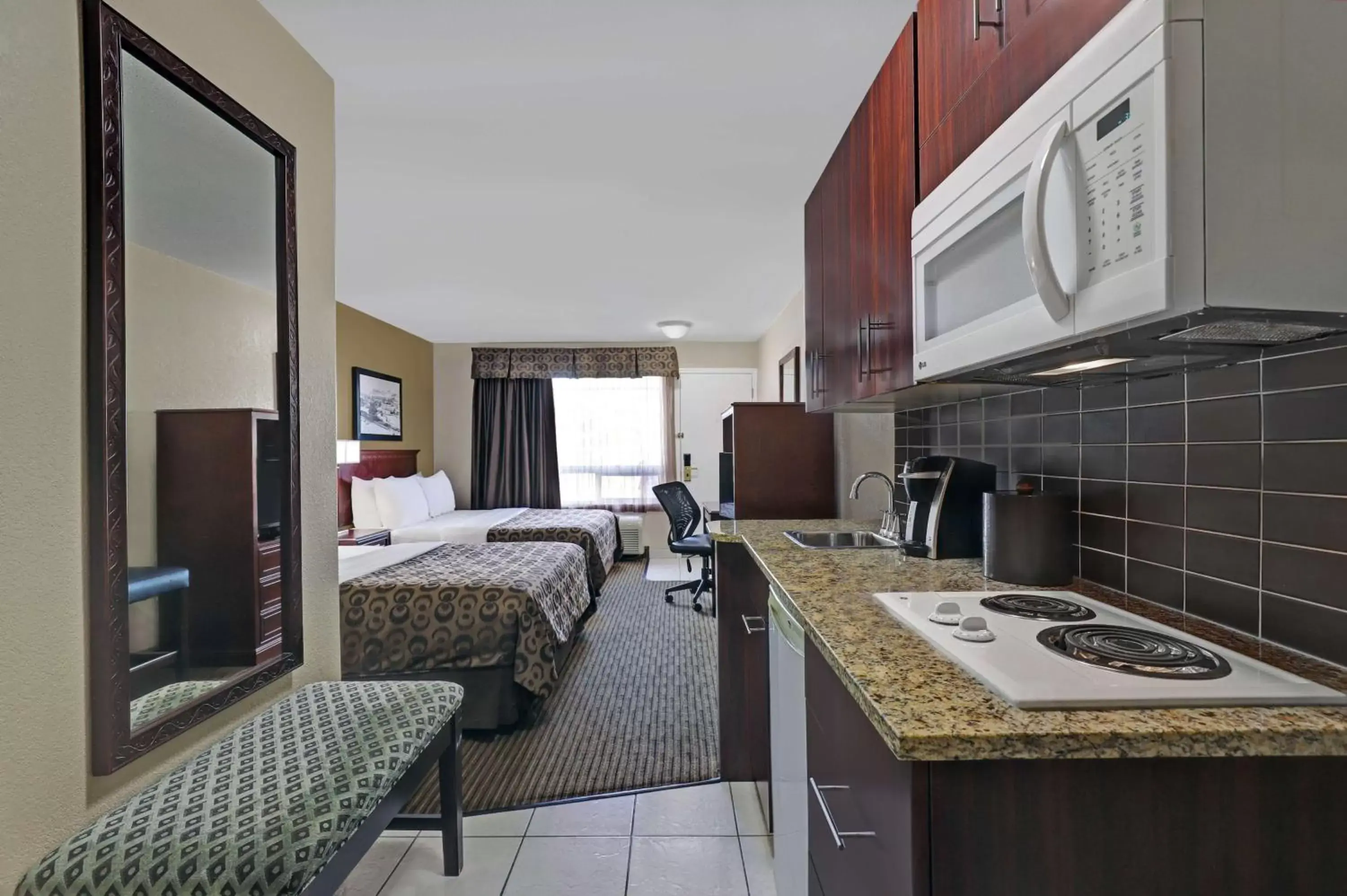 Photo of the whole room, Kitchen/Kitchenette in SureStay Plus Hotel by Best Western Drumheller