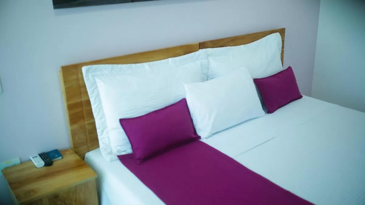 Bed in Kamaleb Farallones Hotel