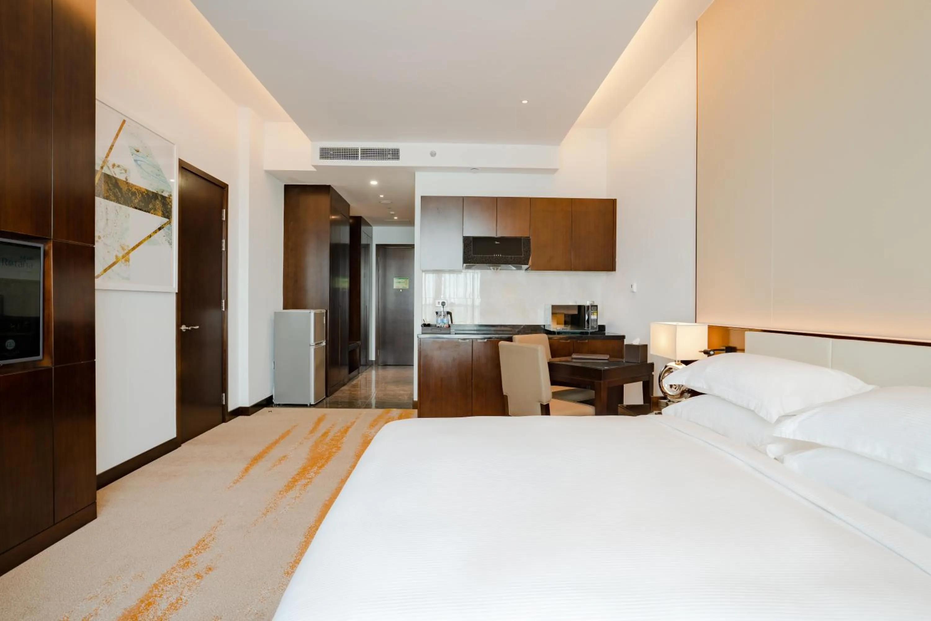 Kitchen or kitchenette, Bed in Johari Rotana