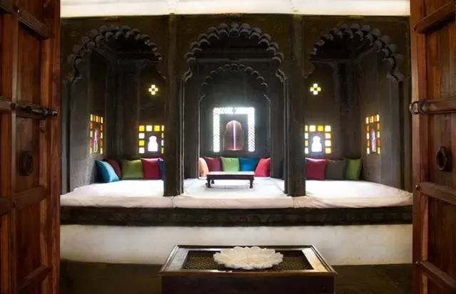 Seating area, Bed in Madri Haveli