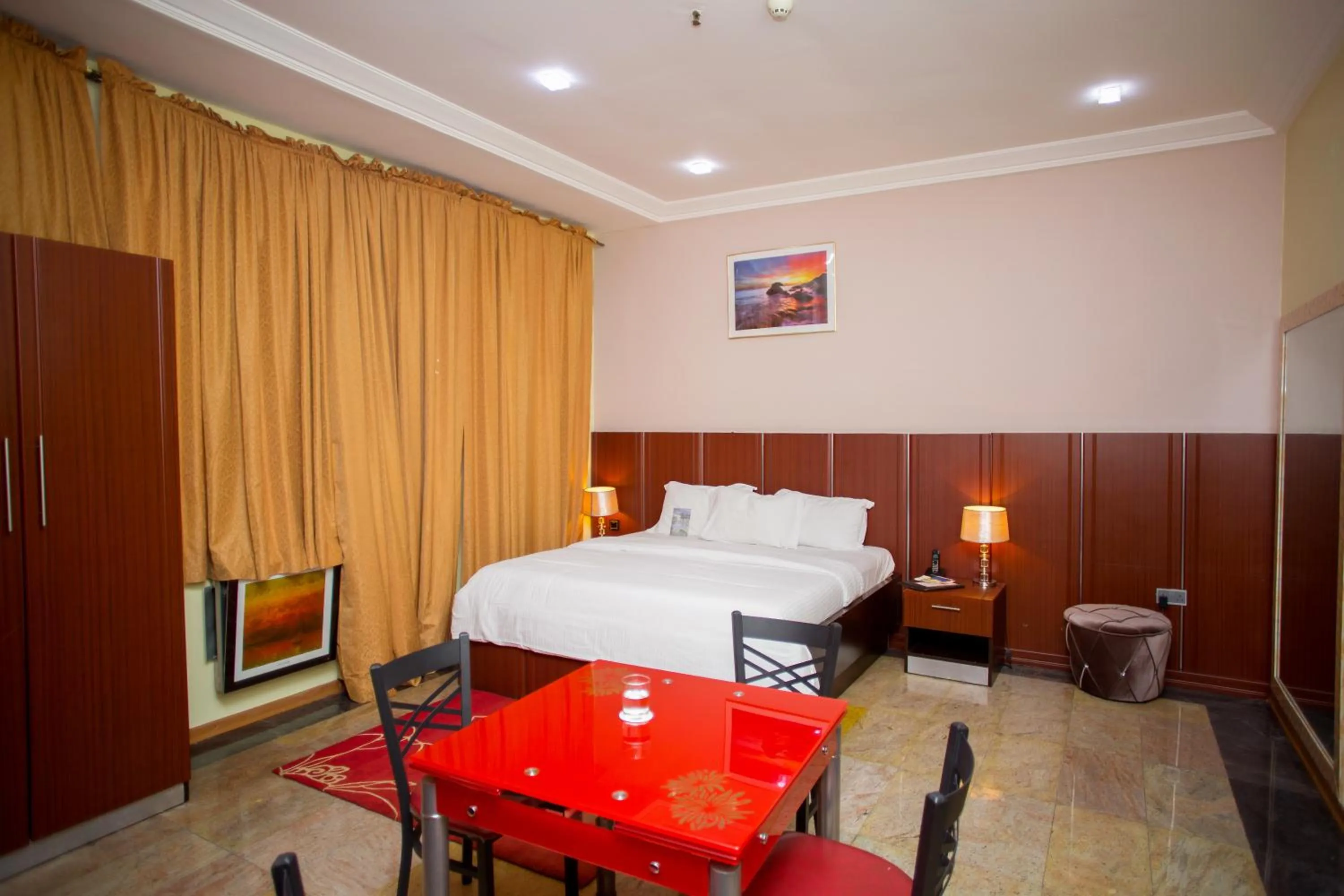 Seating area, Bed in Swiss International Mabisel Port Harcourt
