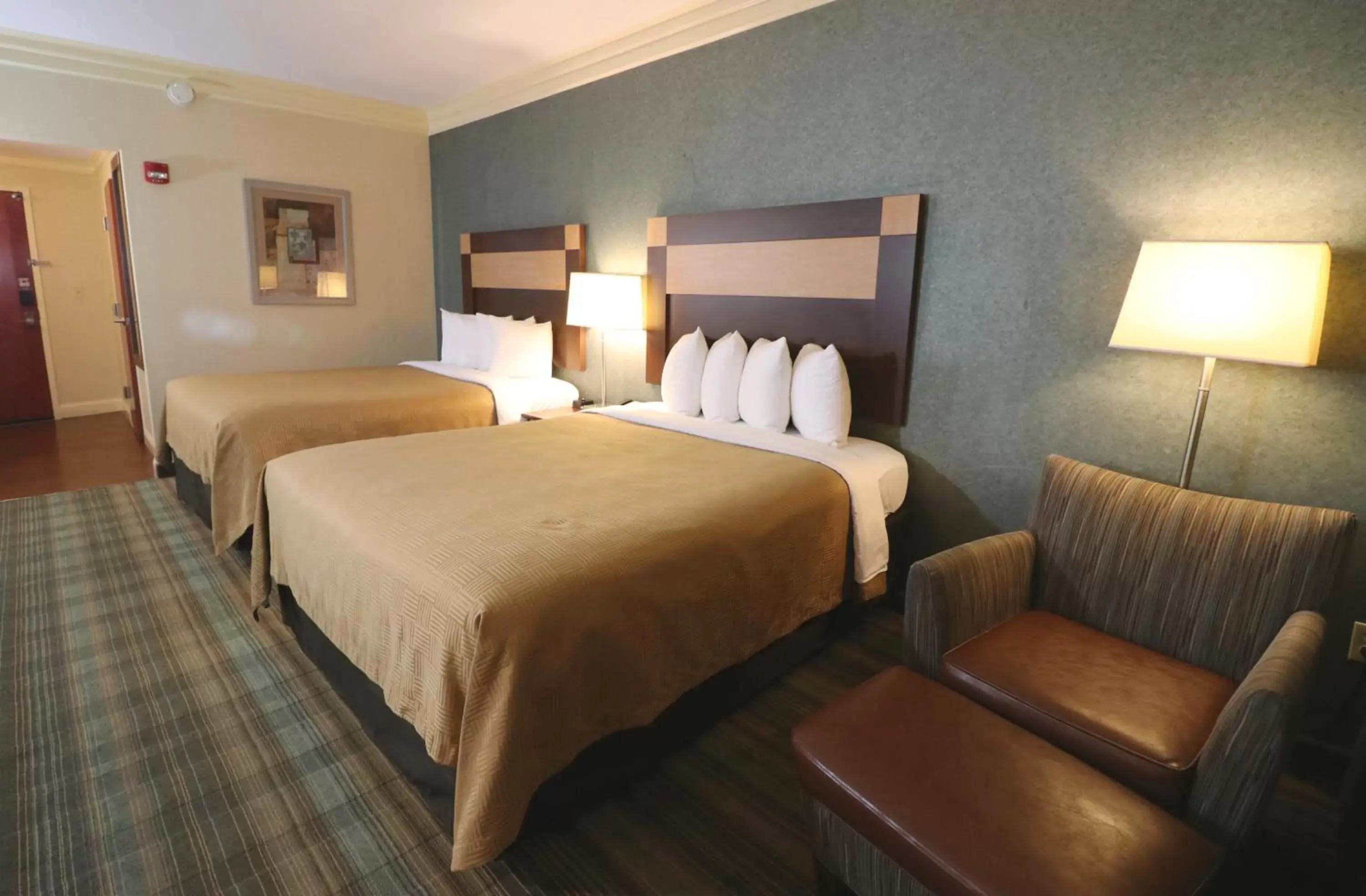 Photo of the whole room, Bed in Clarion Inn Near Island Drive