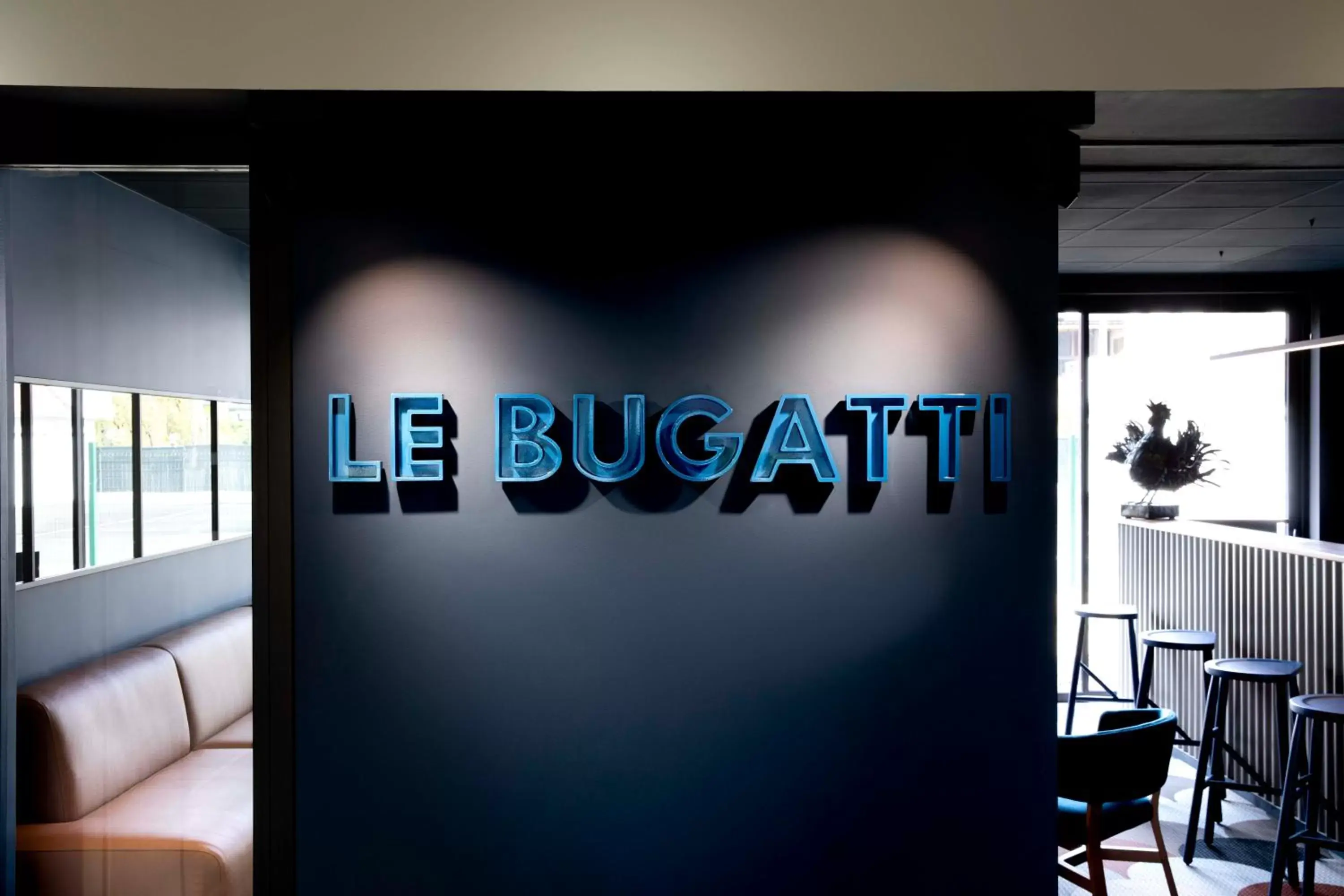 Property logo or sign in Hotel Le Bugatti