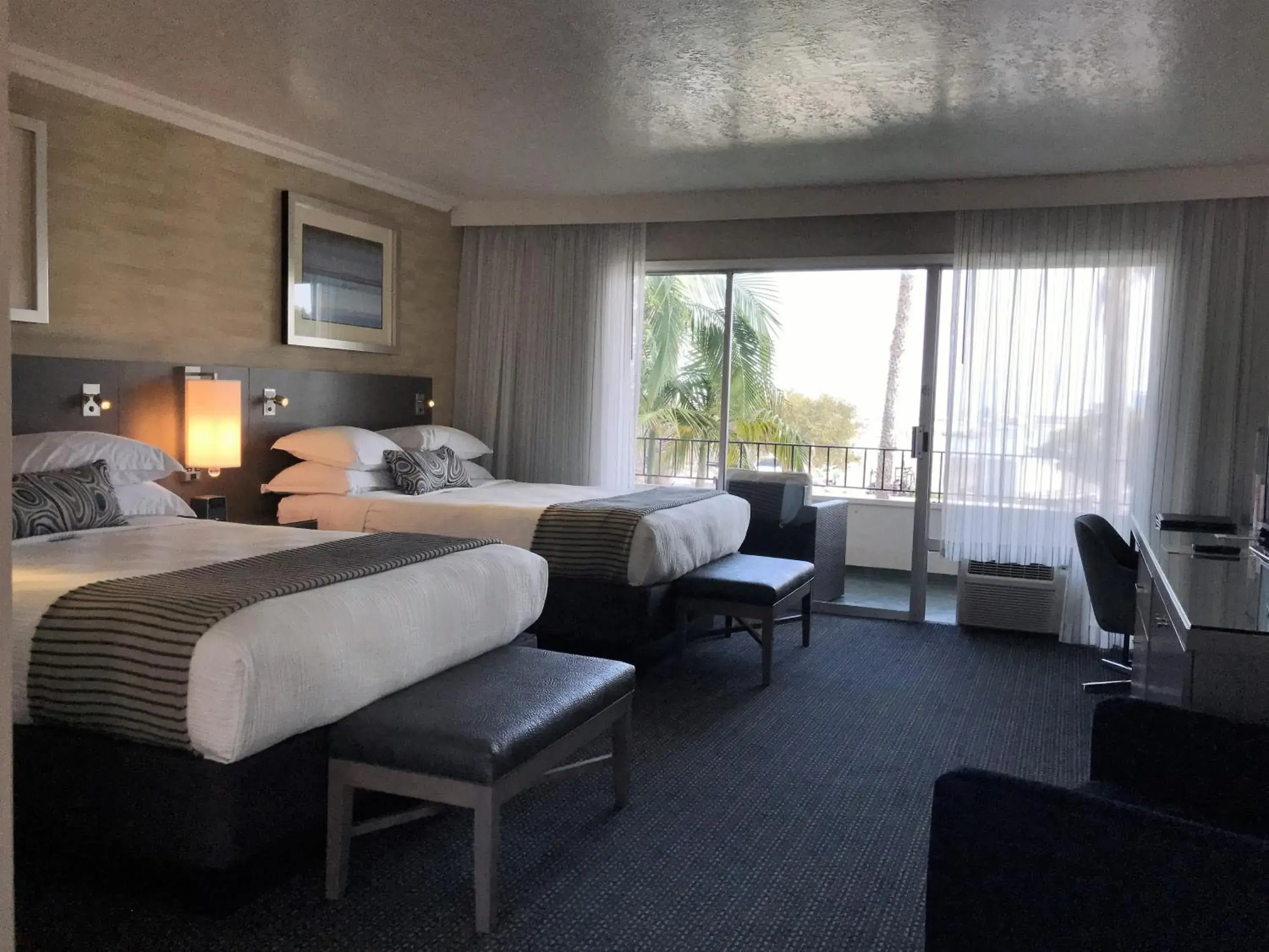 Bed in West Beach Inn, a Coast Hotel