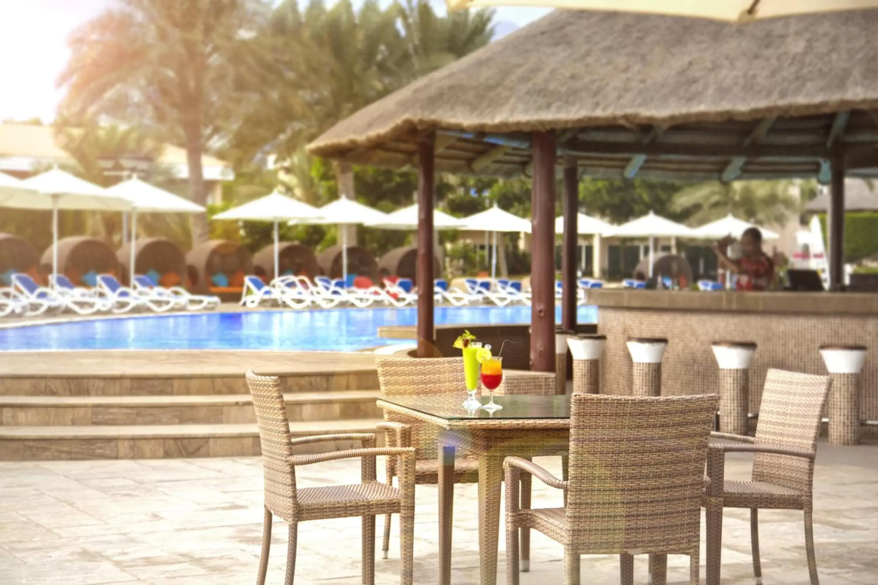 Restaurant/places to eat, Swimming Pool in Fujairah Rotana Resort & Spa - Al Aqah Beach