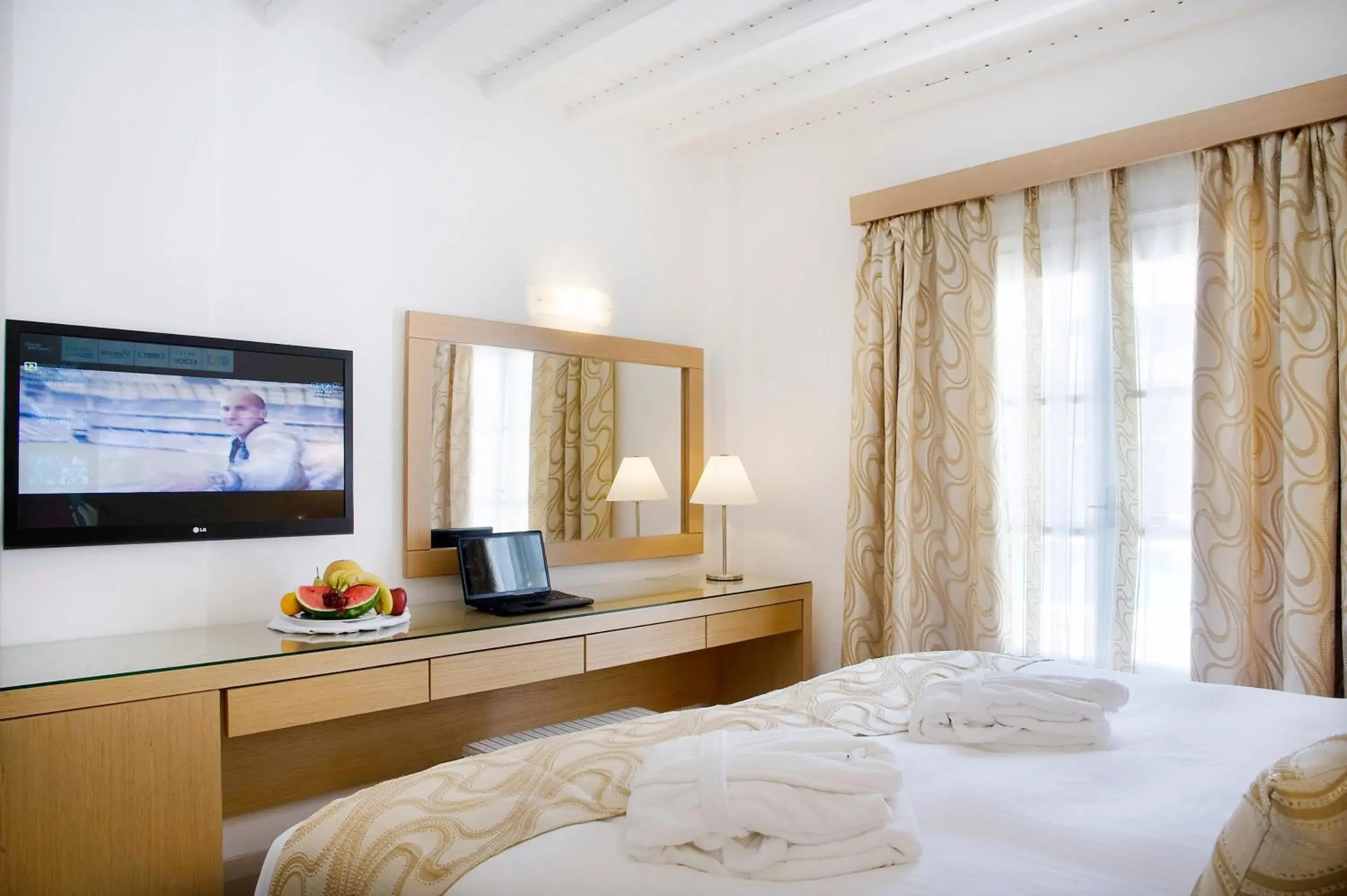 Bed, TV/Entertainment Center in Dionysos Hotel