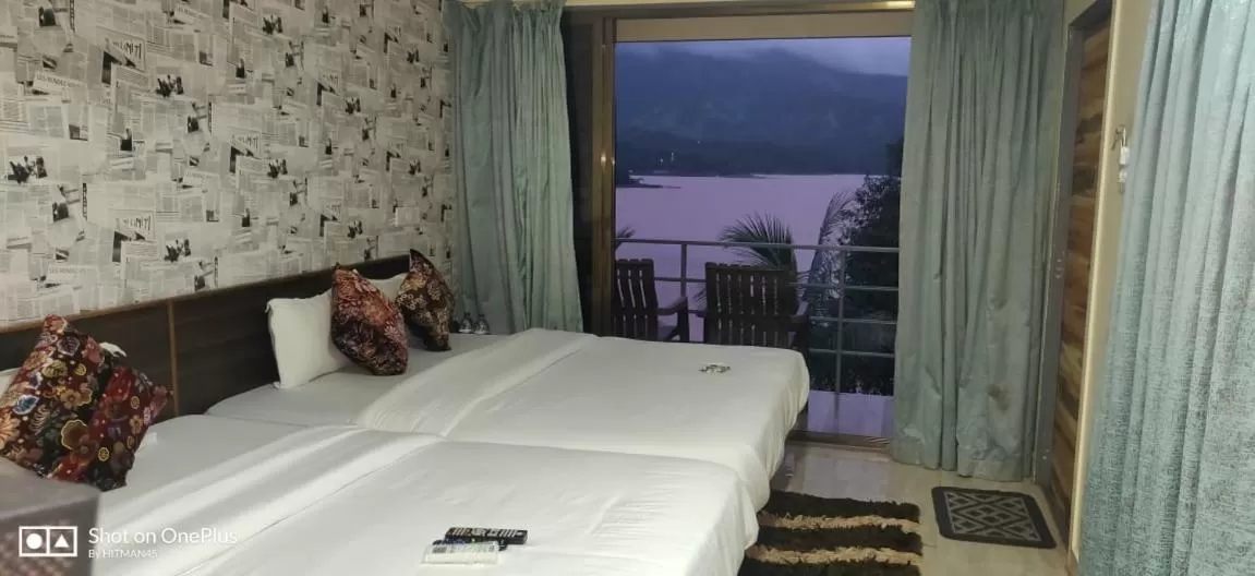 Bed in THE NIHAL RESORT