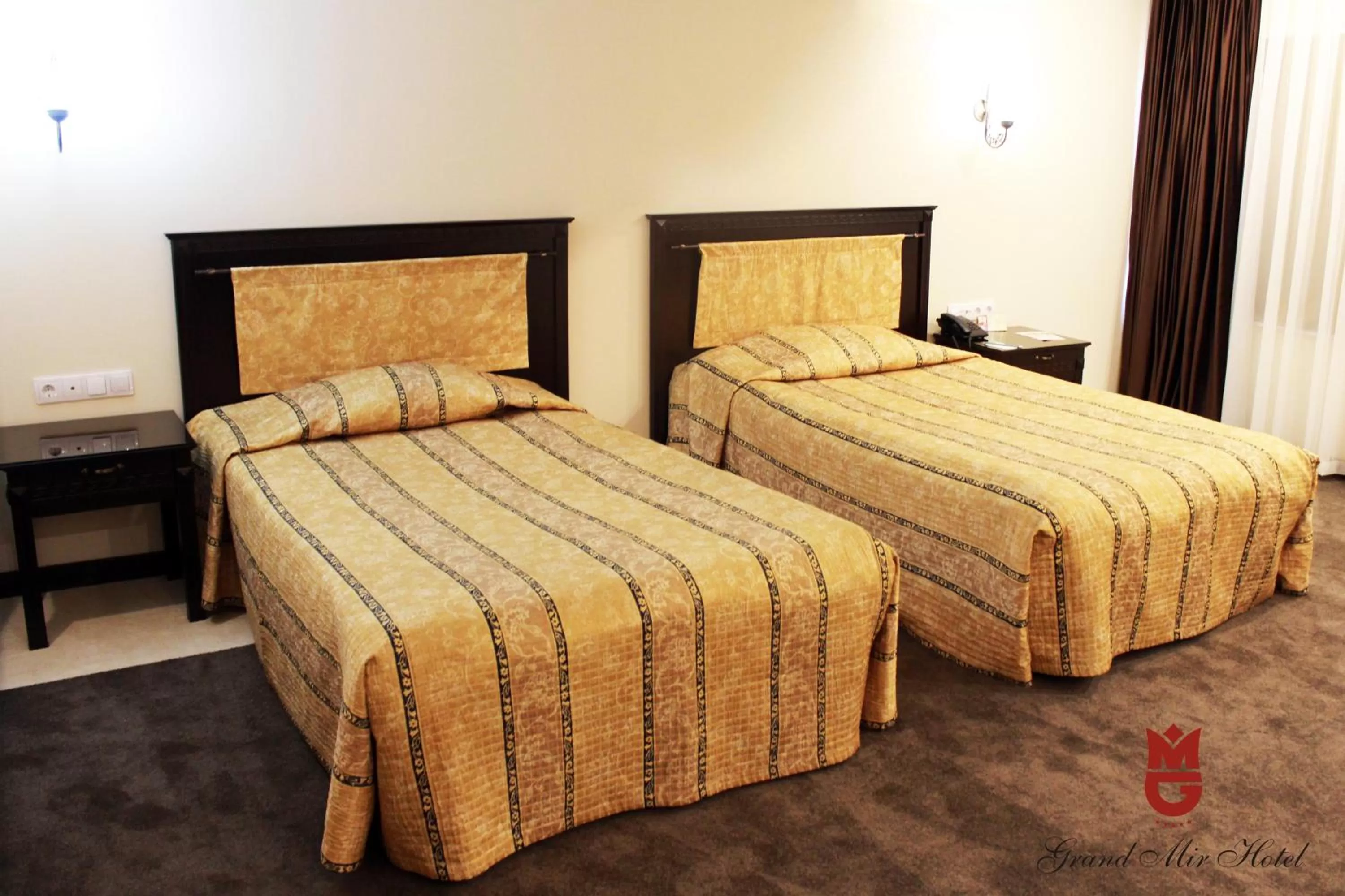 Bed in Grand Mir Hotel