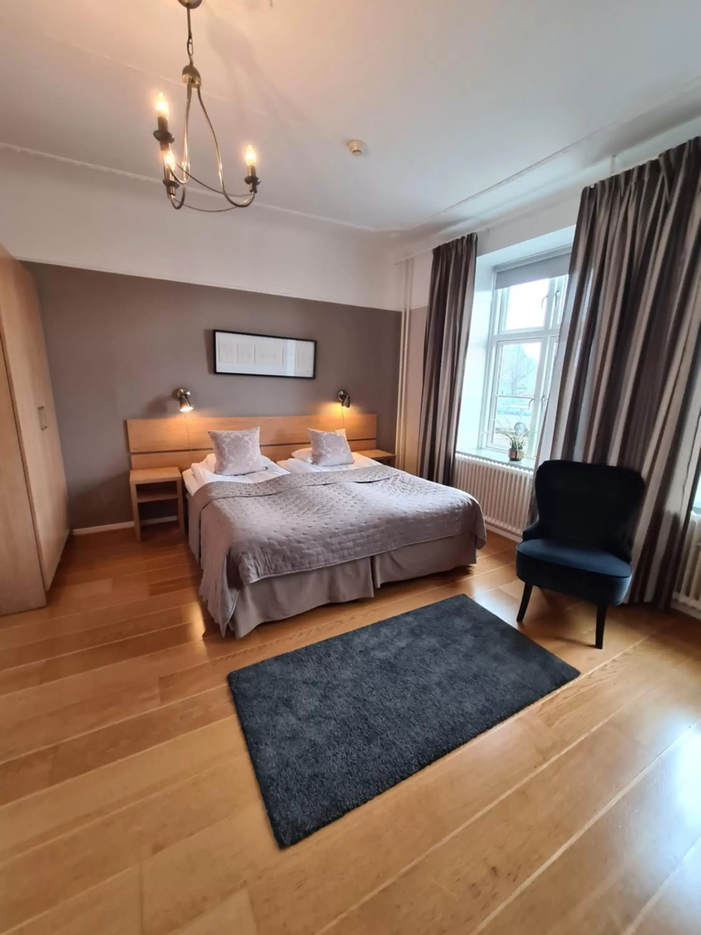 Photo of the whole room, Bed in Hamnhotellet Kronan