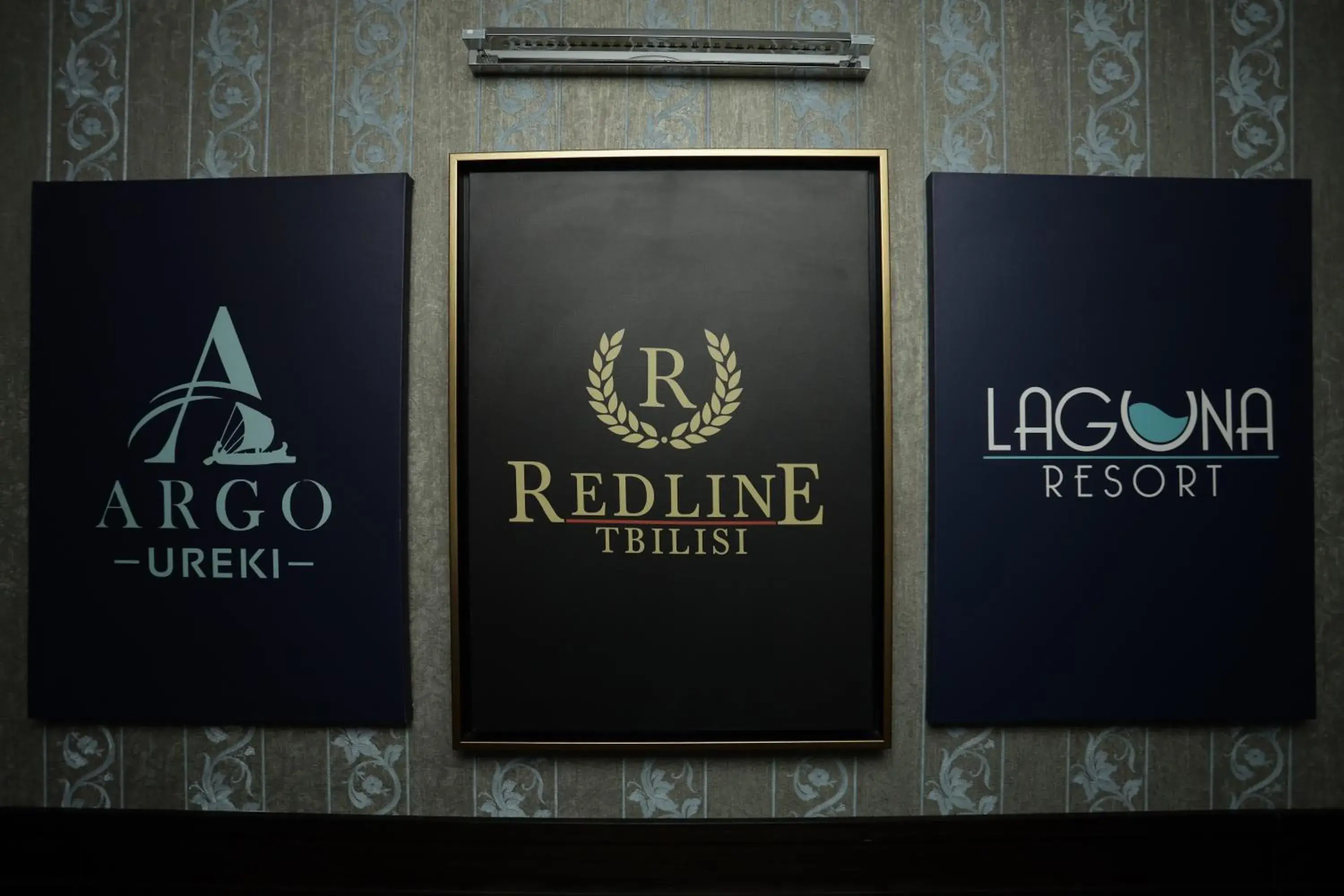 Property logo or sign in Redline Hotel