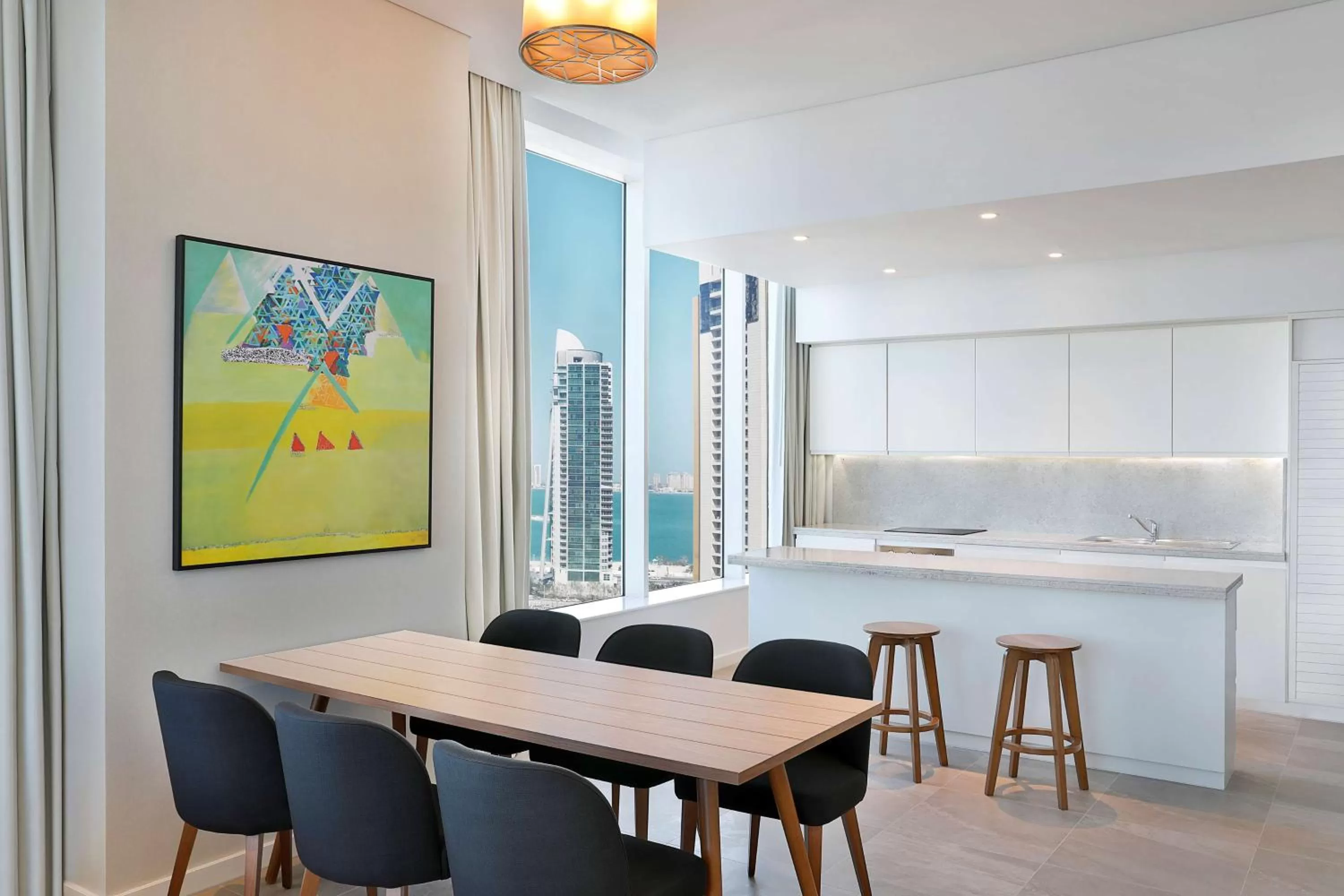 Kitchen or kitchenette in Aleph Doha Residences, Curio Collection By Hilton