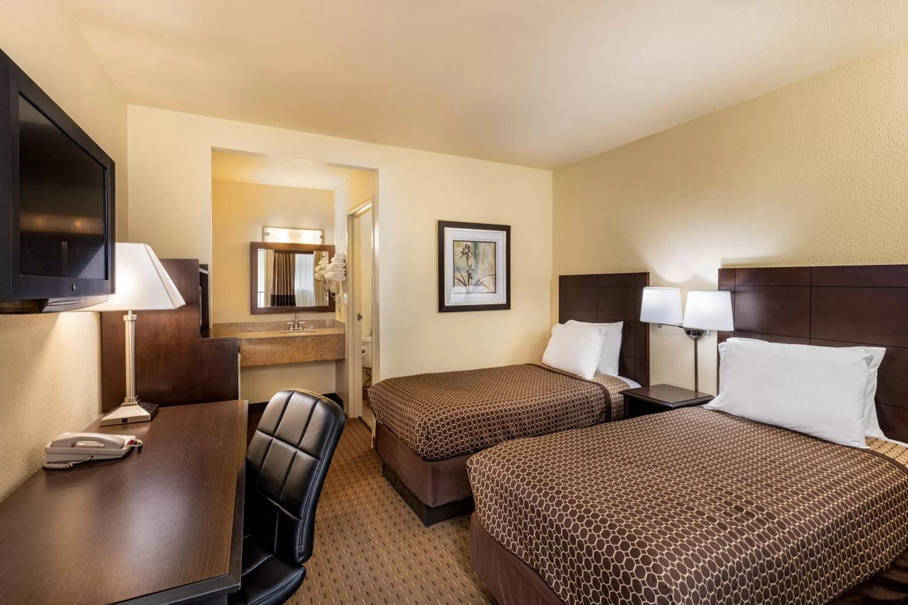 Bed in Key Inn and Suites