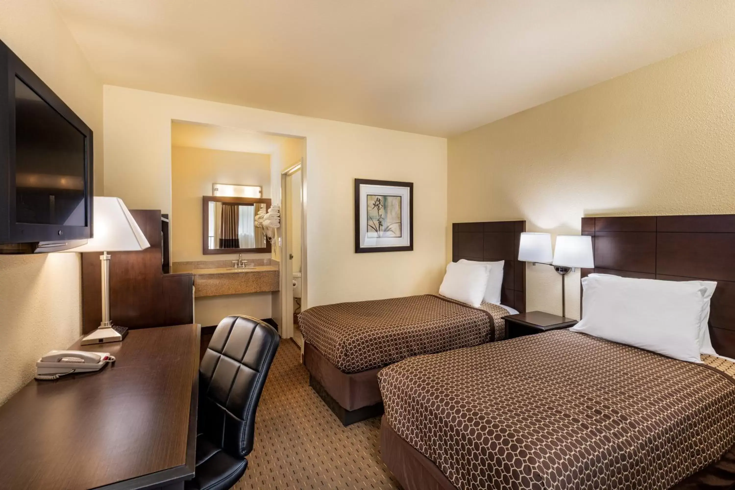 Bed in Key Inn And Suites