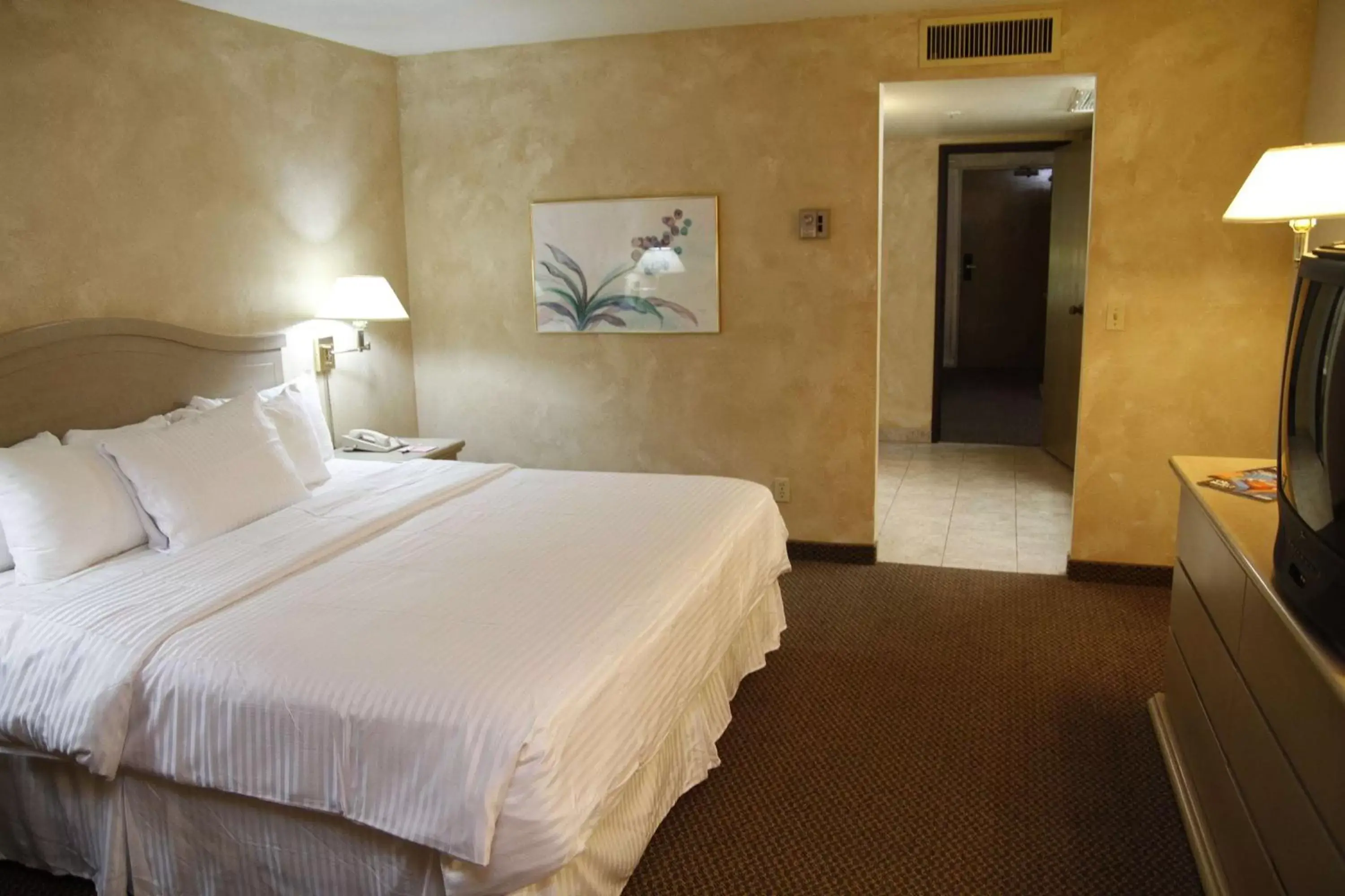 Photo of the whole room, Bed in Ramada by Wyndham Viscount Suites Tucson East