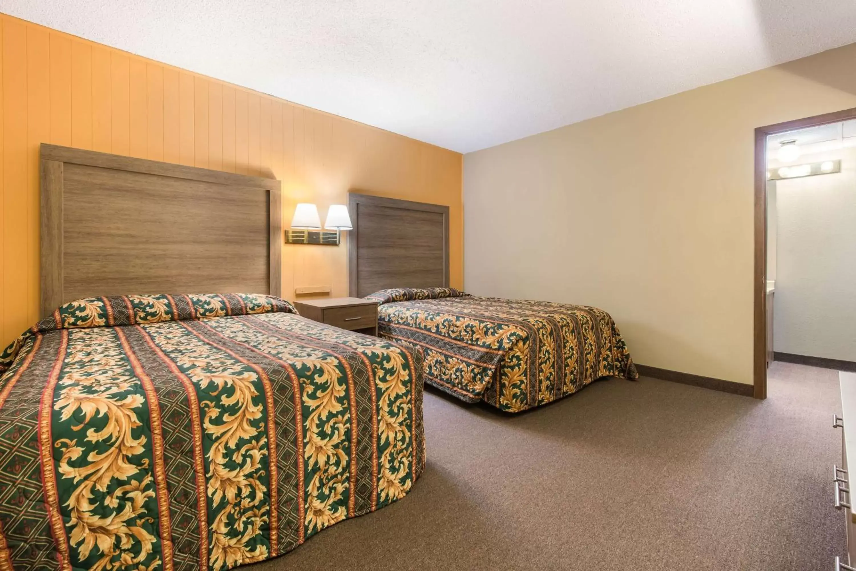 Bed in LeConte Motor Lodge A Ramada by Wyndham