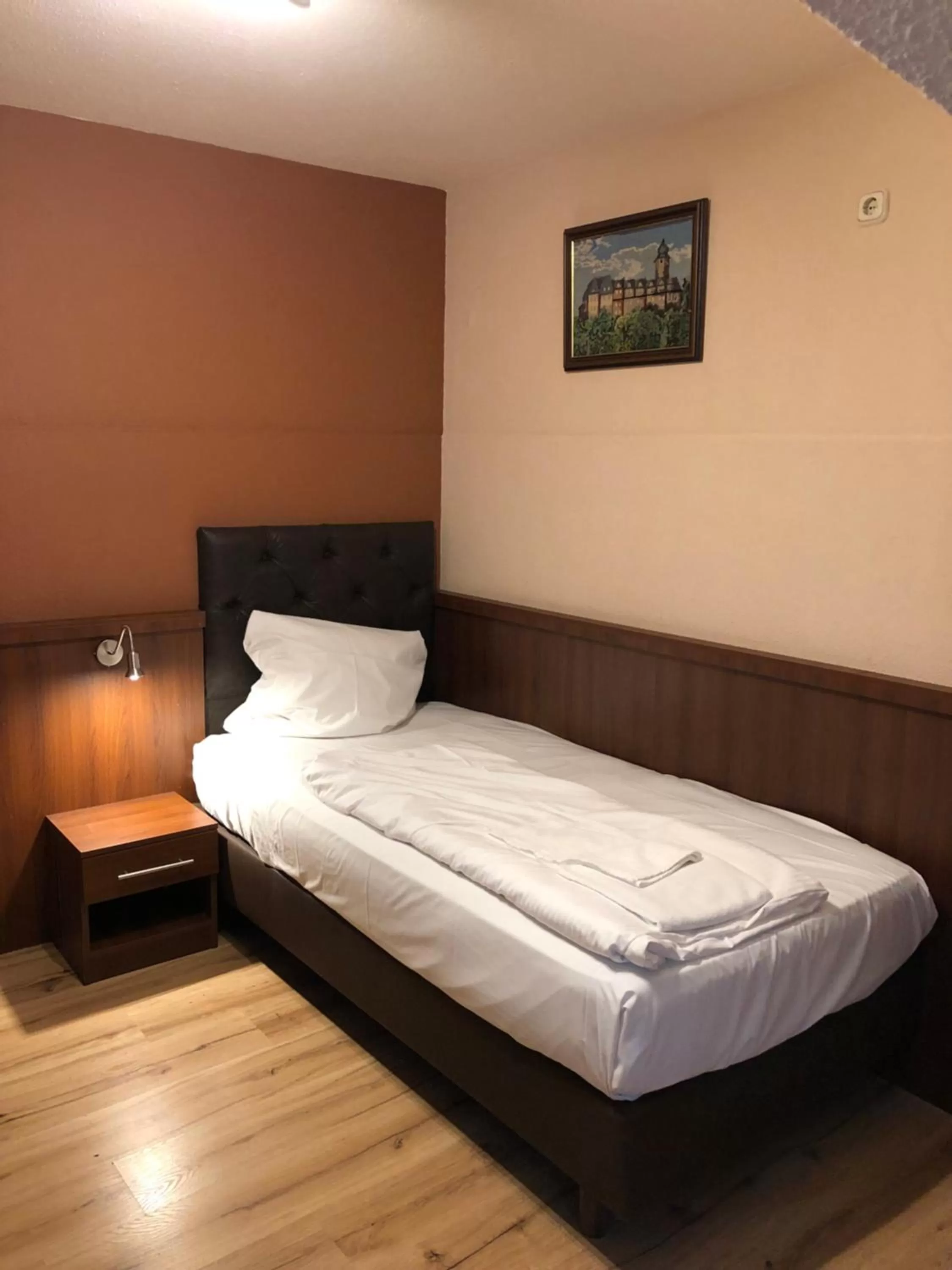 Bed in Hotel Poseidon