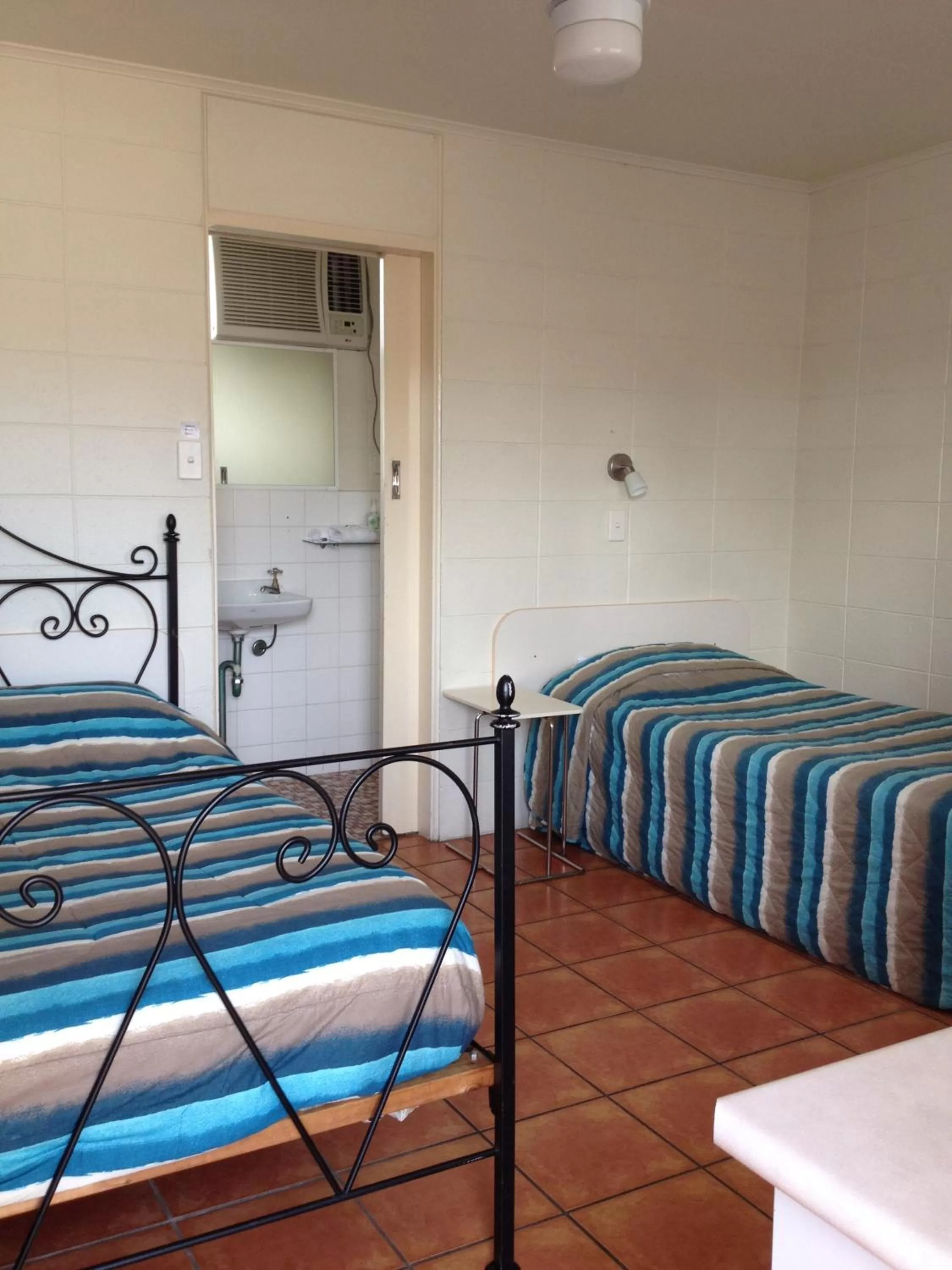 Bed in Sunburst Motel