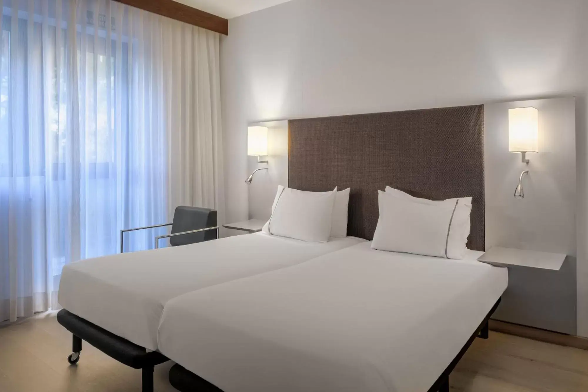 Bed in AC Hotel by Marriott Pisa