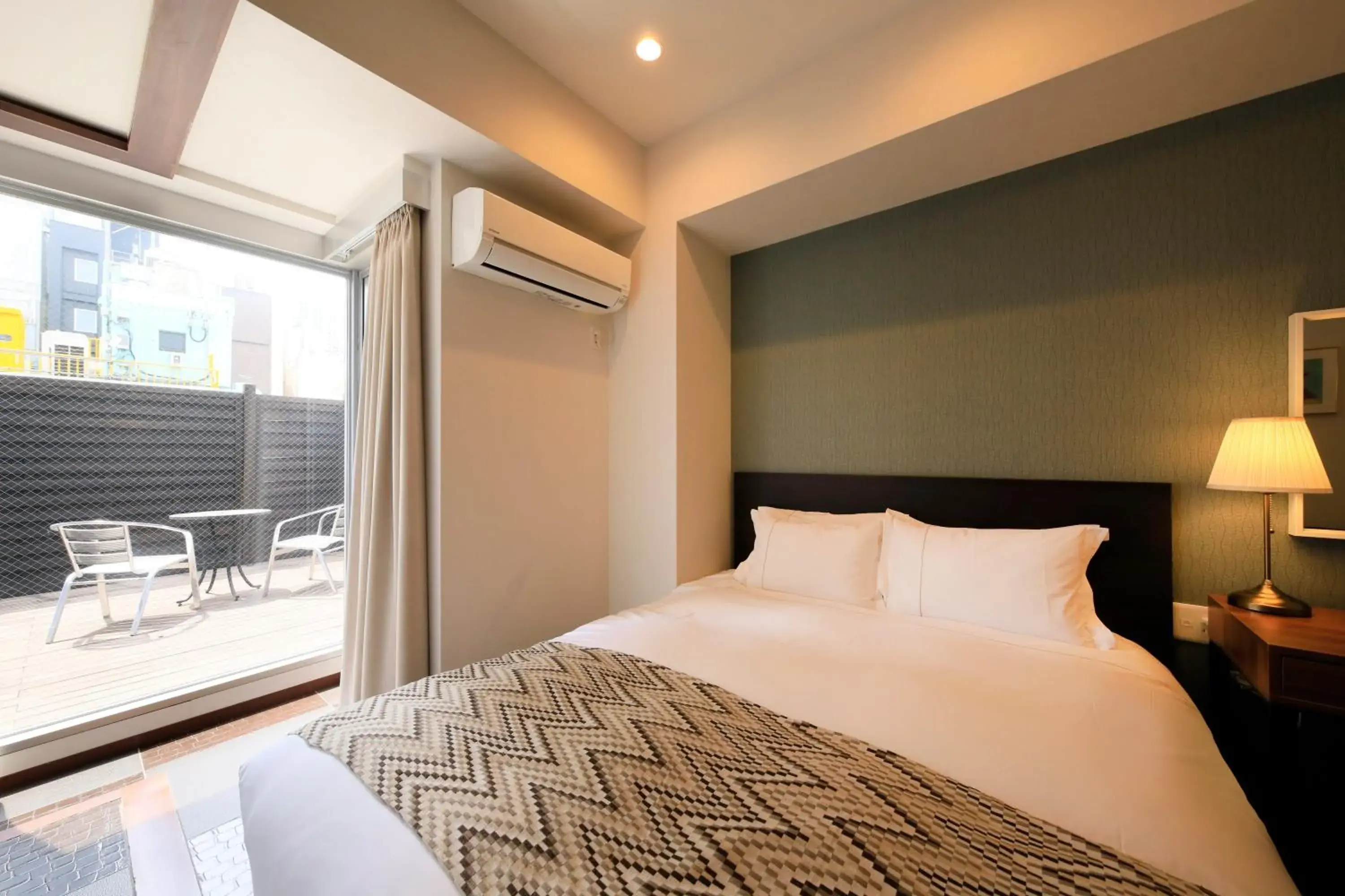 Photo of the whole room, Bed in Centurion Hotel Residential Akasaka Station