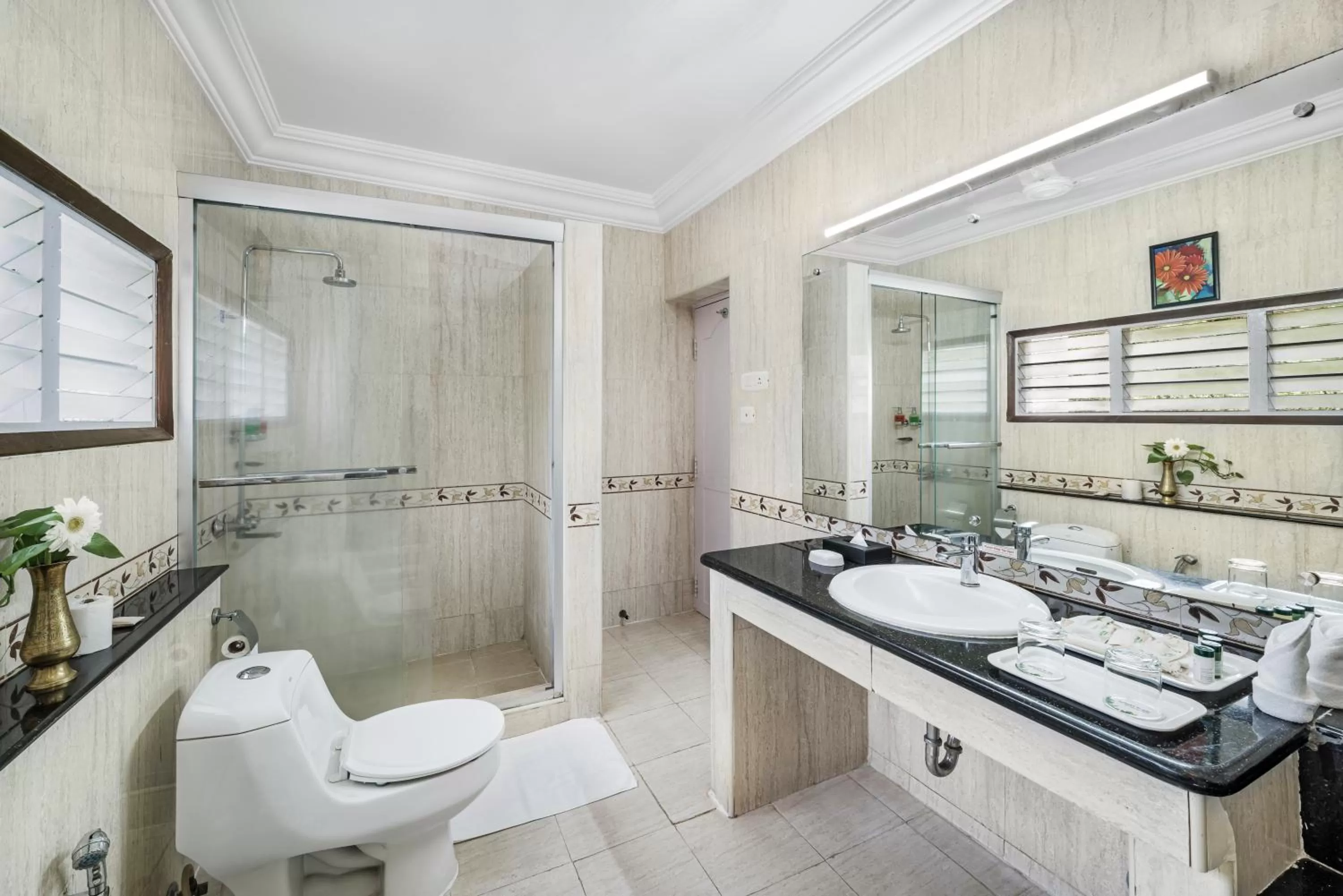 Bathroom in GReaT Trails Riverview Thanjavur By GRT Hotels