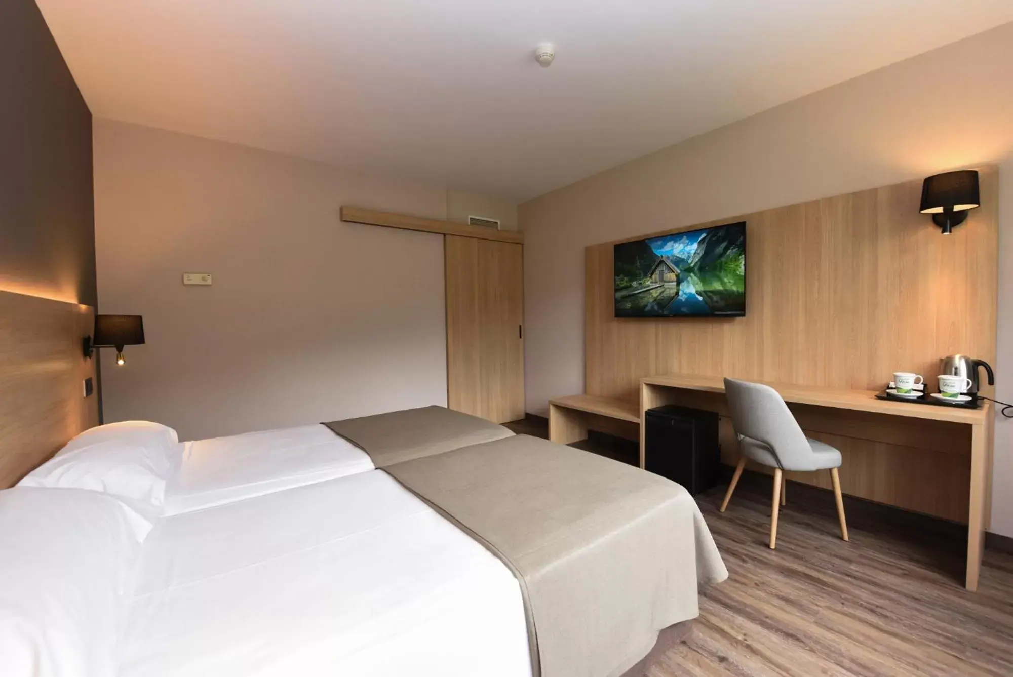 Bed in SOMMOS Hotel Benasque Spa Bed in SOMMOS Hotel Benasque Spa