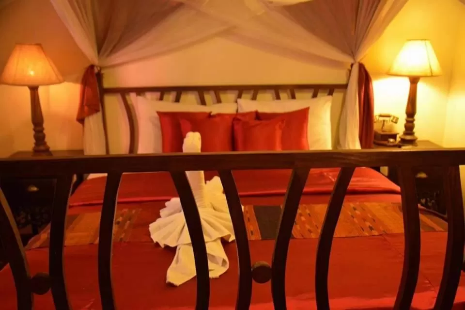 Bed in Tri Yaan Na Ros Colonial House