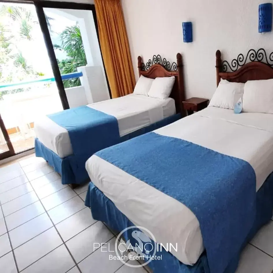 Photo of the whole room in Pelicano Inn Playa del Carmen - Beachfront Hotel