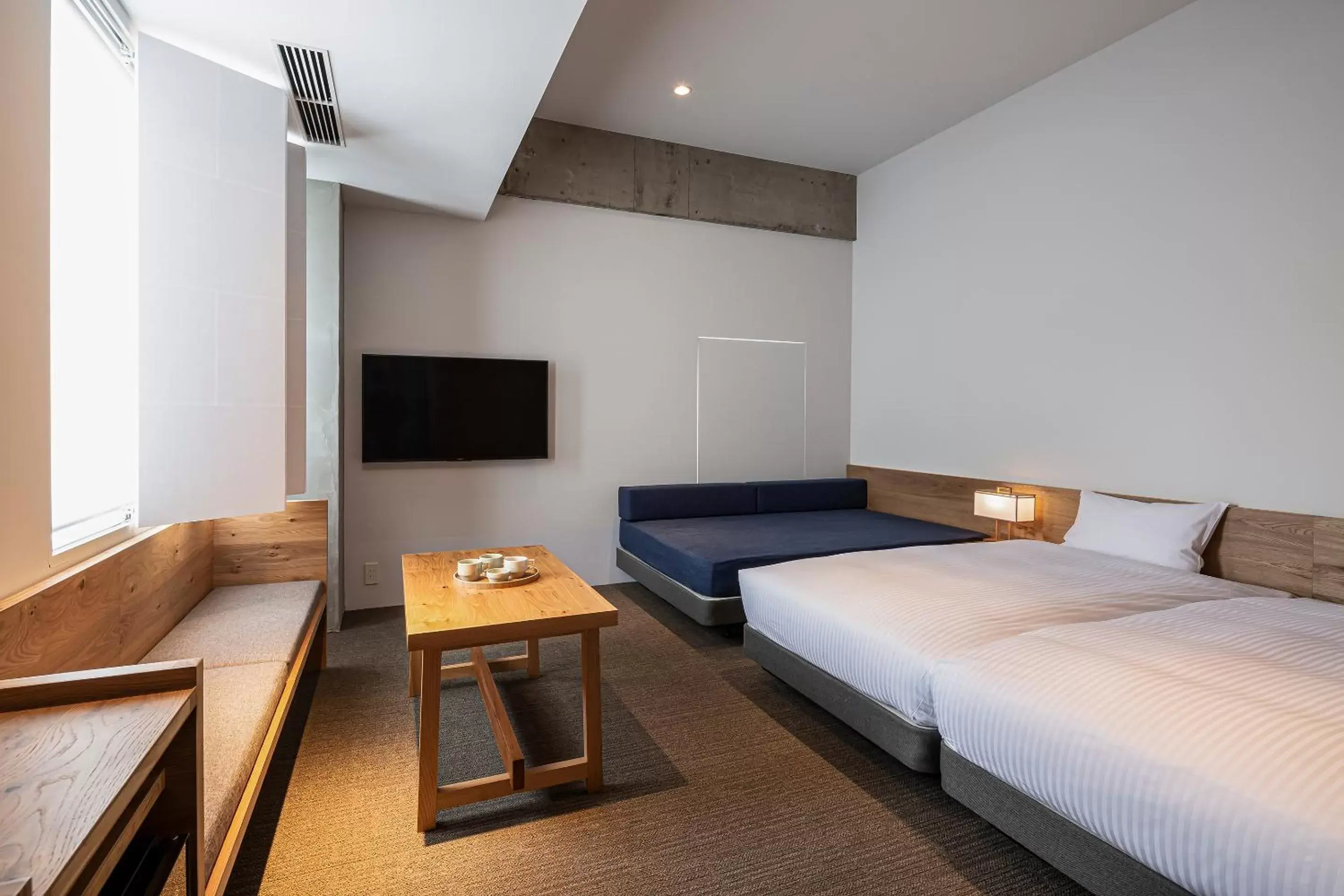 Photo of the whole room, TV/Entertainment Center in TSUGU Kyoto Sanjo by THE SHARE HOTELS