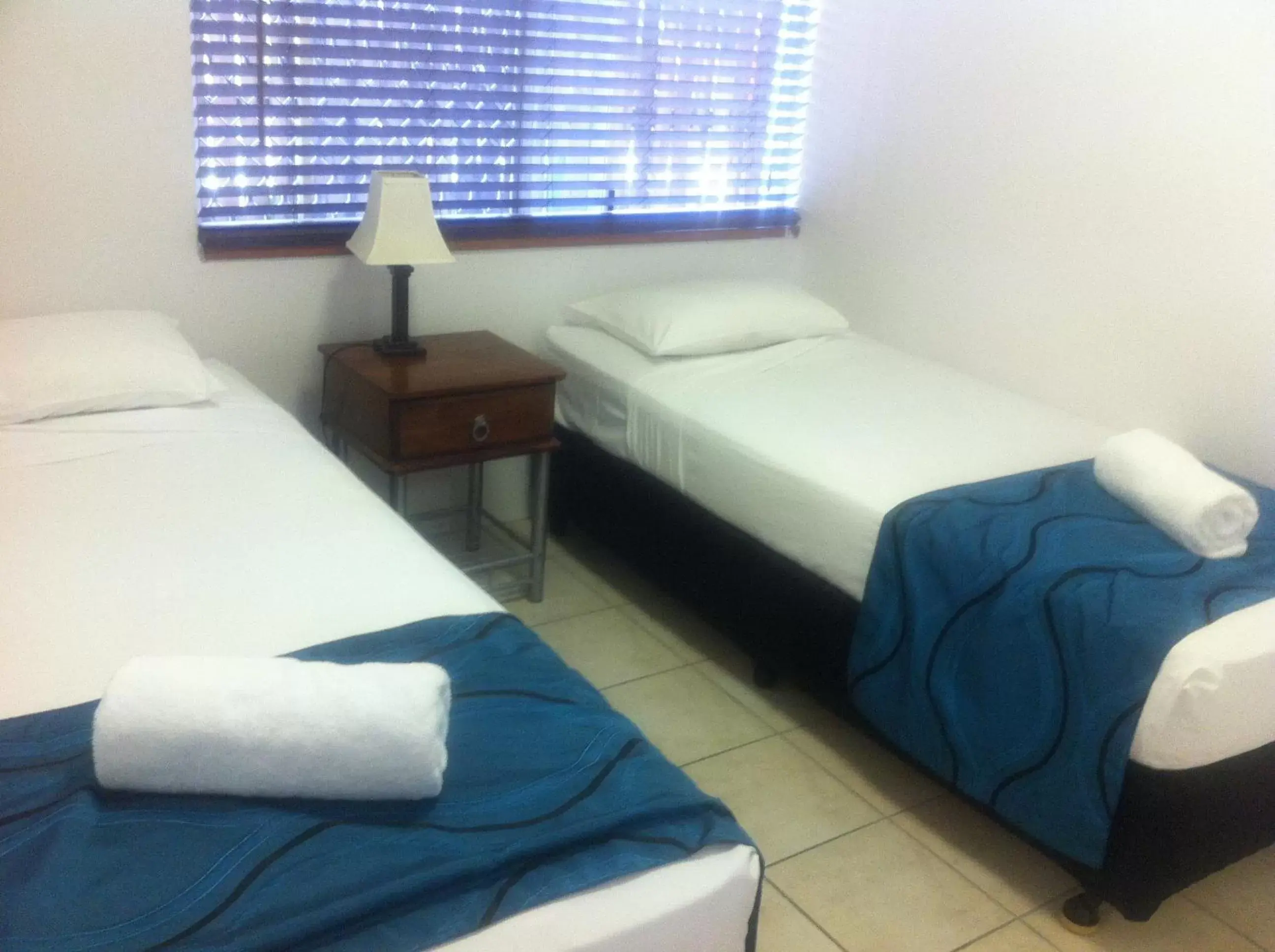 Bed in Reef Gateway Apartments