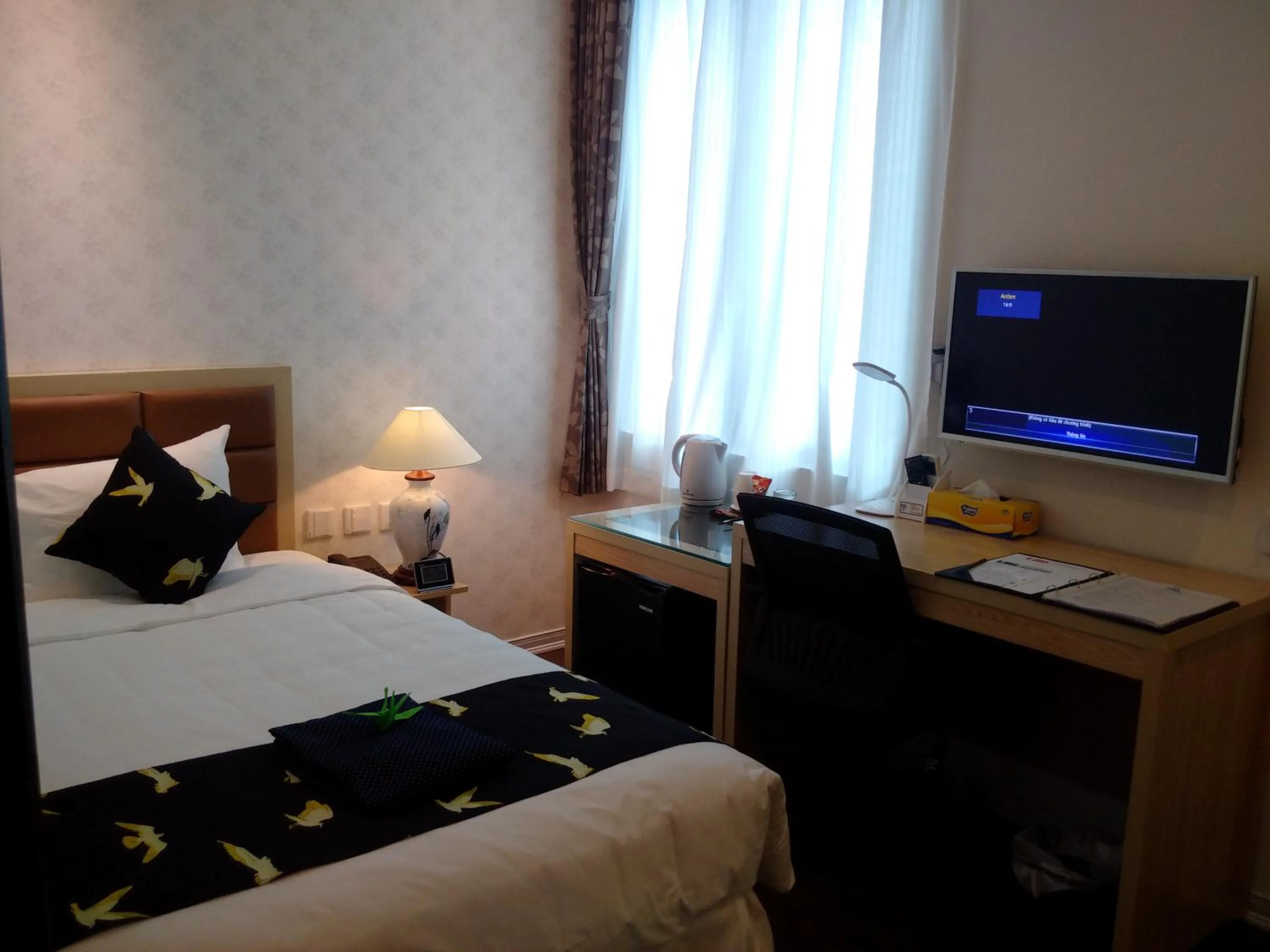 Bed in Momizi Business Hotel