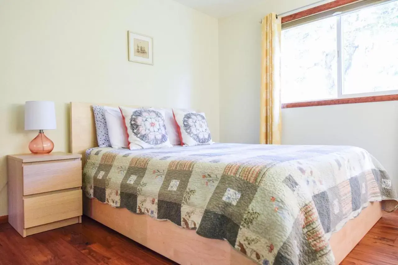 Bed in Brown & Hawkins Historical Apartments