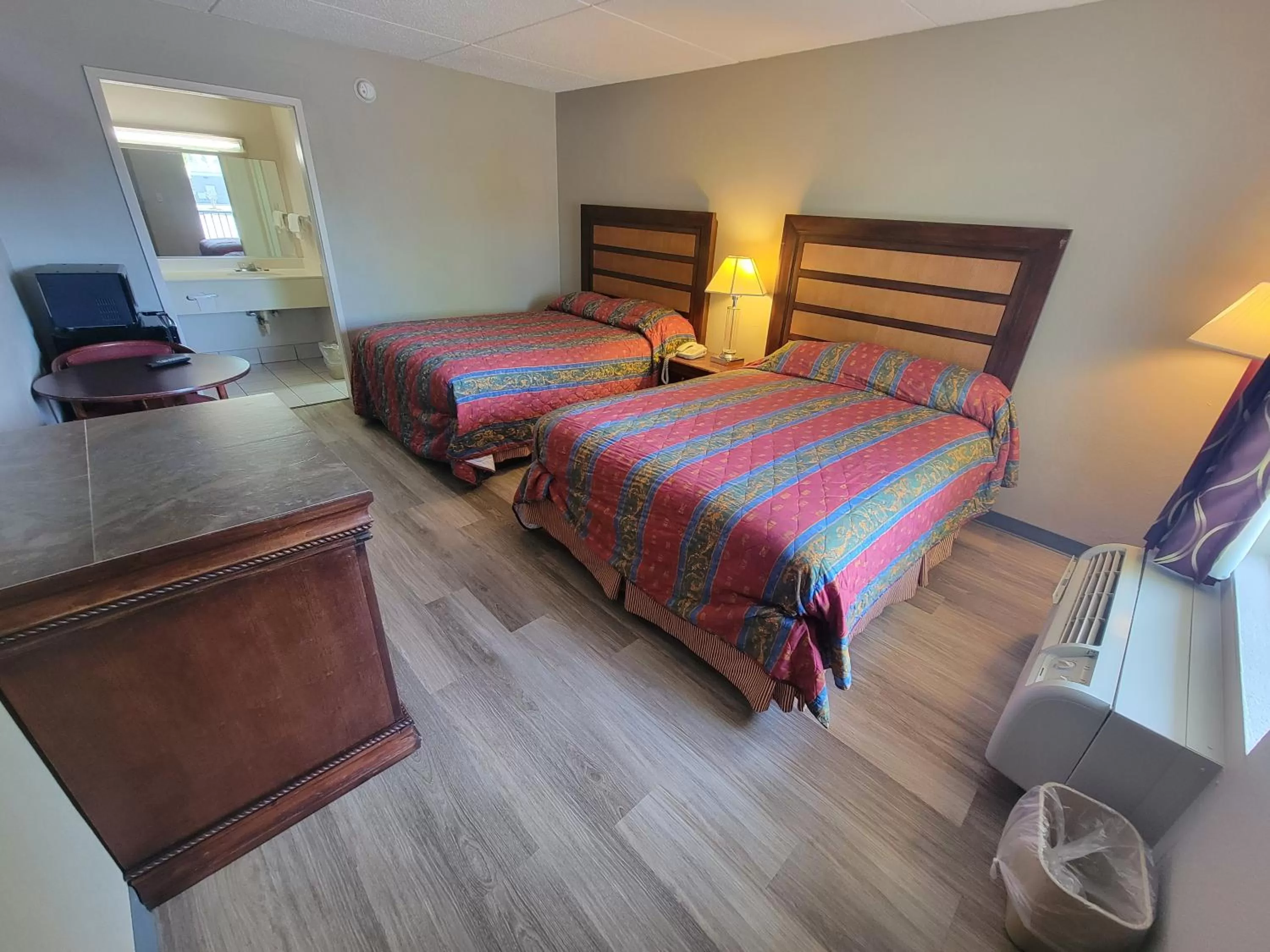 Bed in Studio 9 Inn & Suites