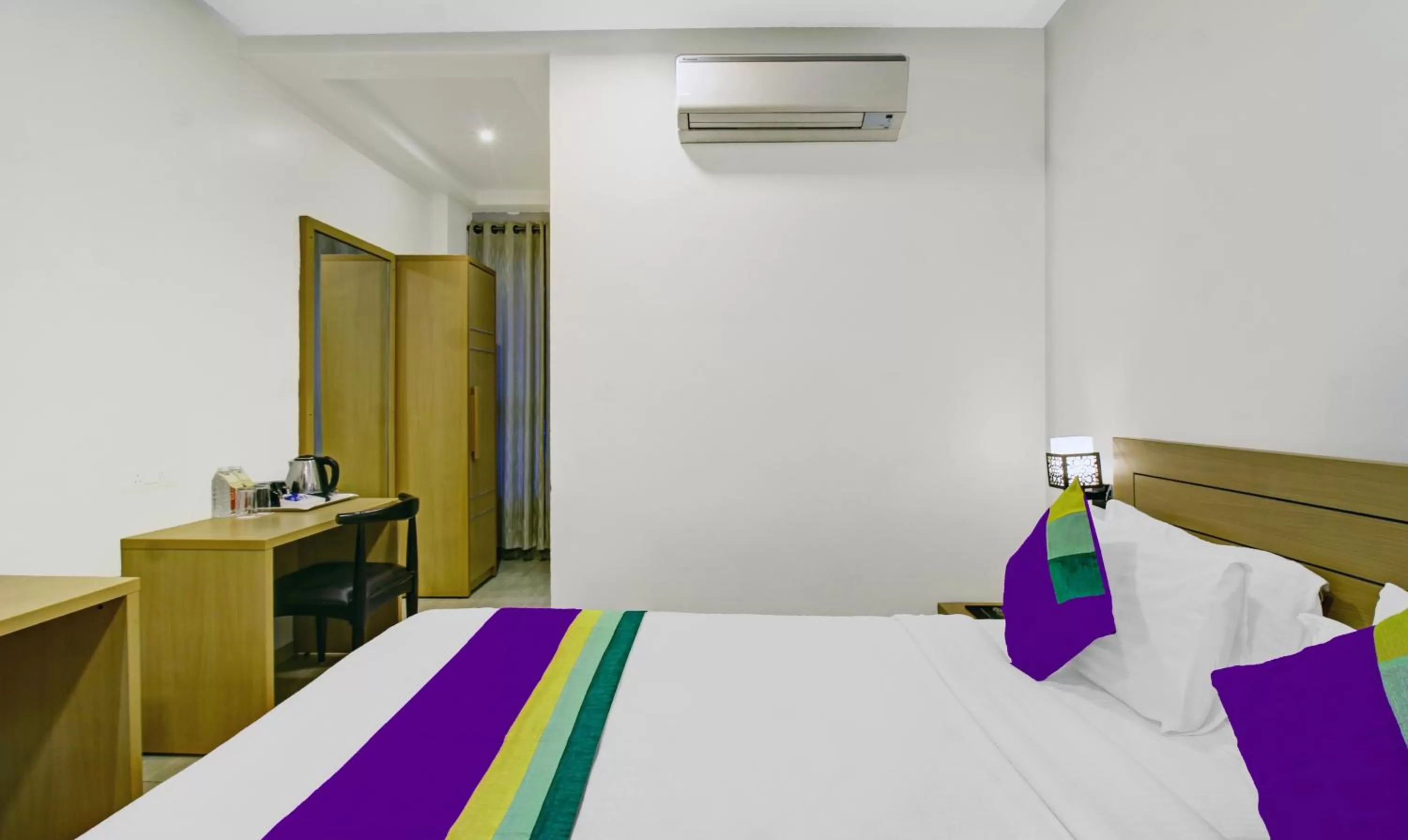 Bed in Treebo Premium Brijinn