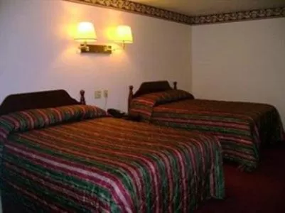 Bed in Passport Inn & Suites Chaplin