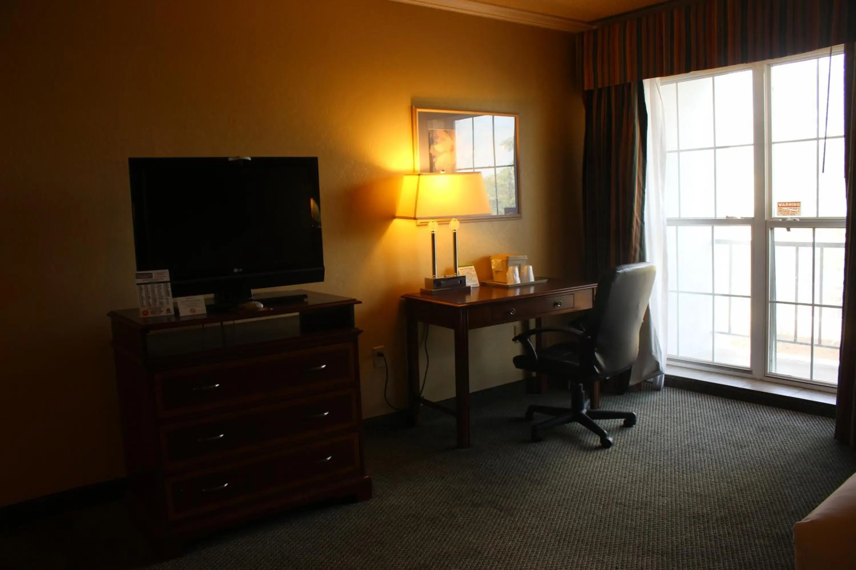 Bedroom, TV/Entertainment Center in Extend-A-Suites - Amarillo West