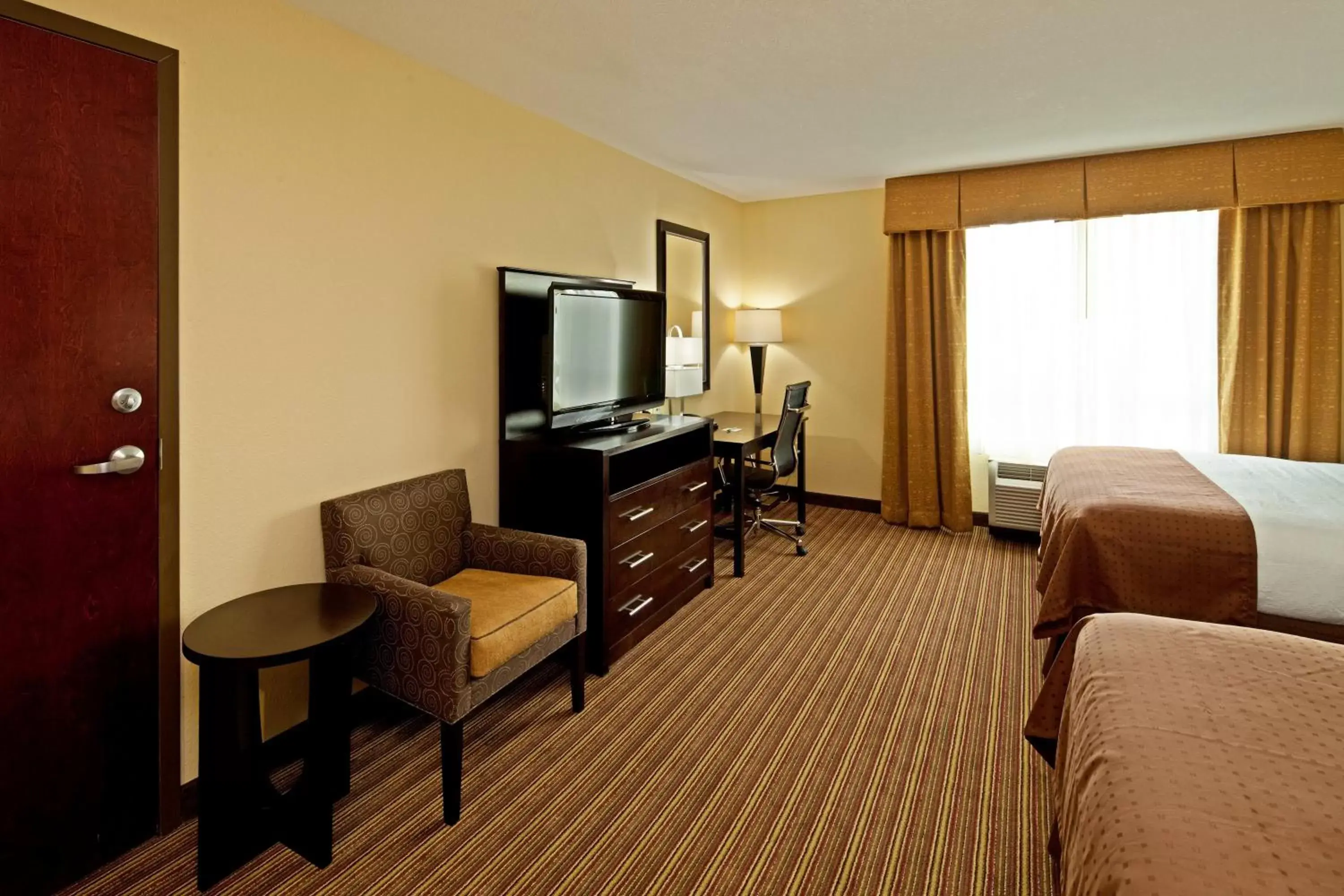 Photo of the whole room, TV/Entertainment Center in Holiday Inn Mobile Airport, an IHG Hotel