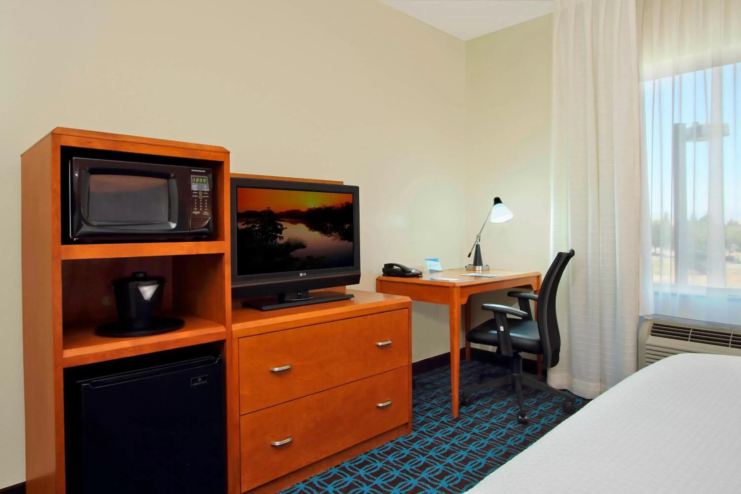 Photo of the whole room, TV/Entertainment Center in Fairfield Inn & Suites Fresno Clovis