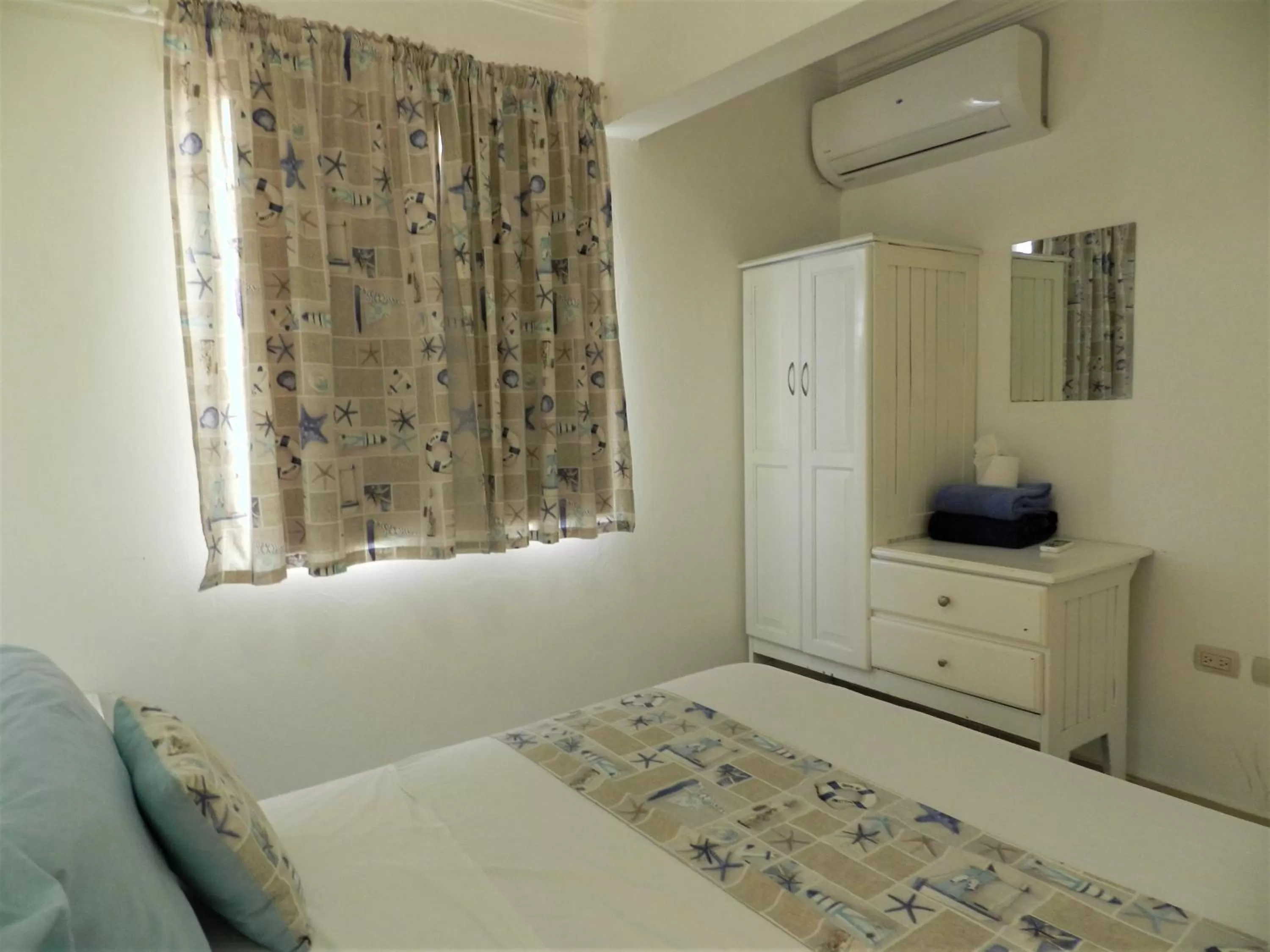 Bedroom, Bed in Karimar Beach Condo Hotel