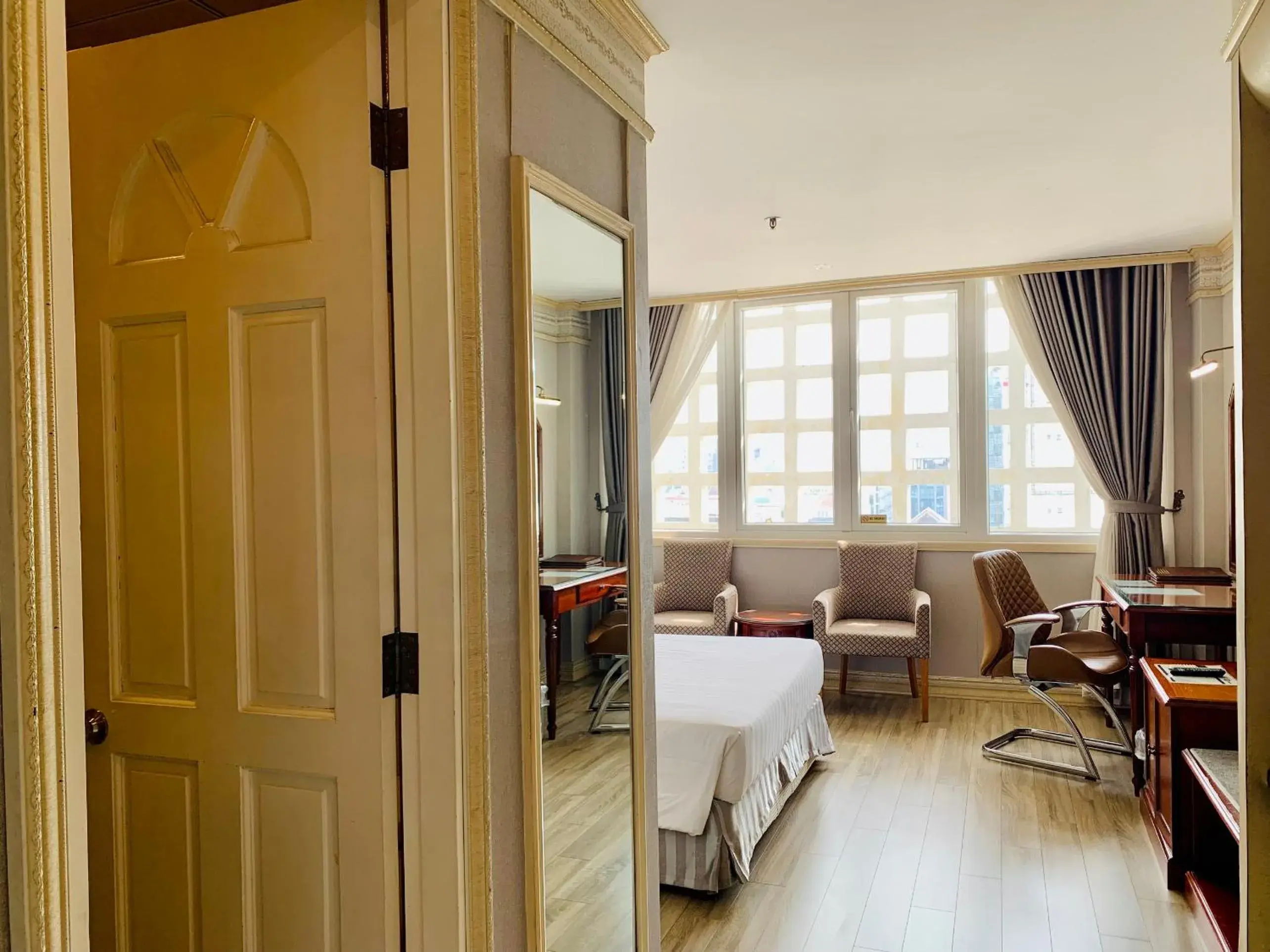 Bedroom, Seating Area in Lotus Saigon Hotel