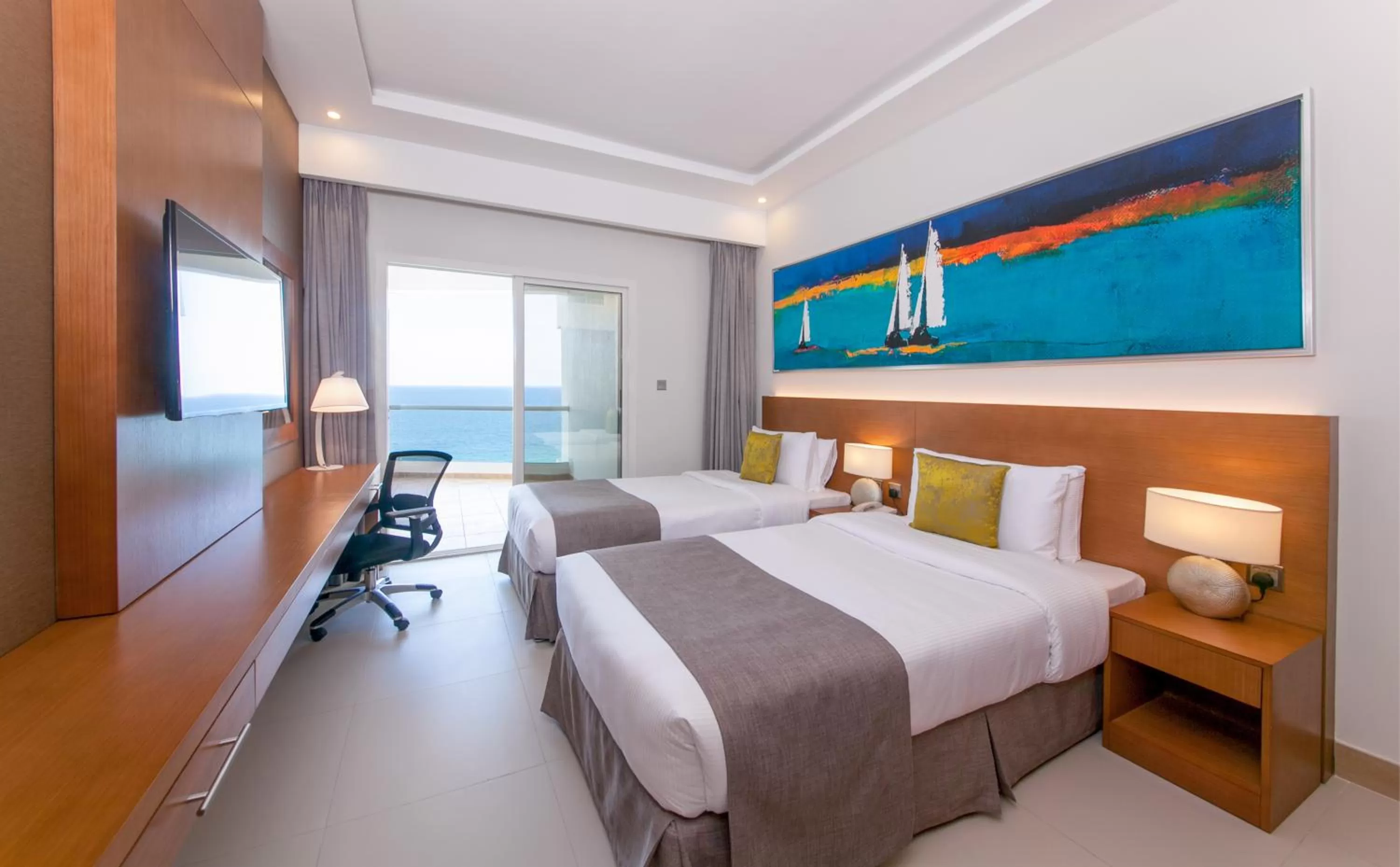 Balcony/Terrace, Bed in Ramada by Wyndham Beach Hotel Ajman