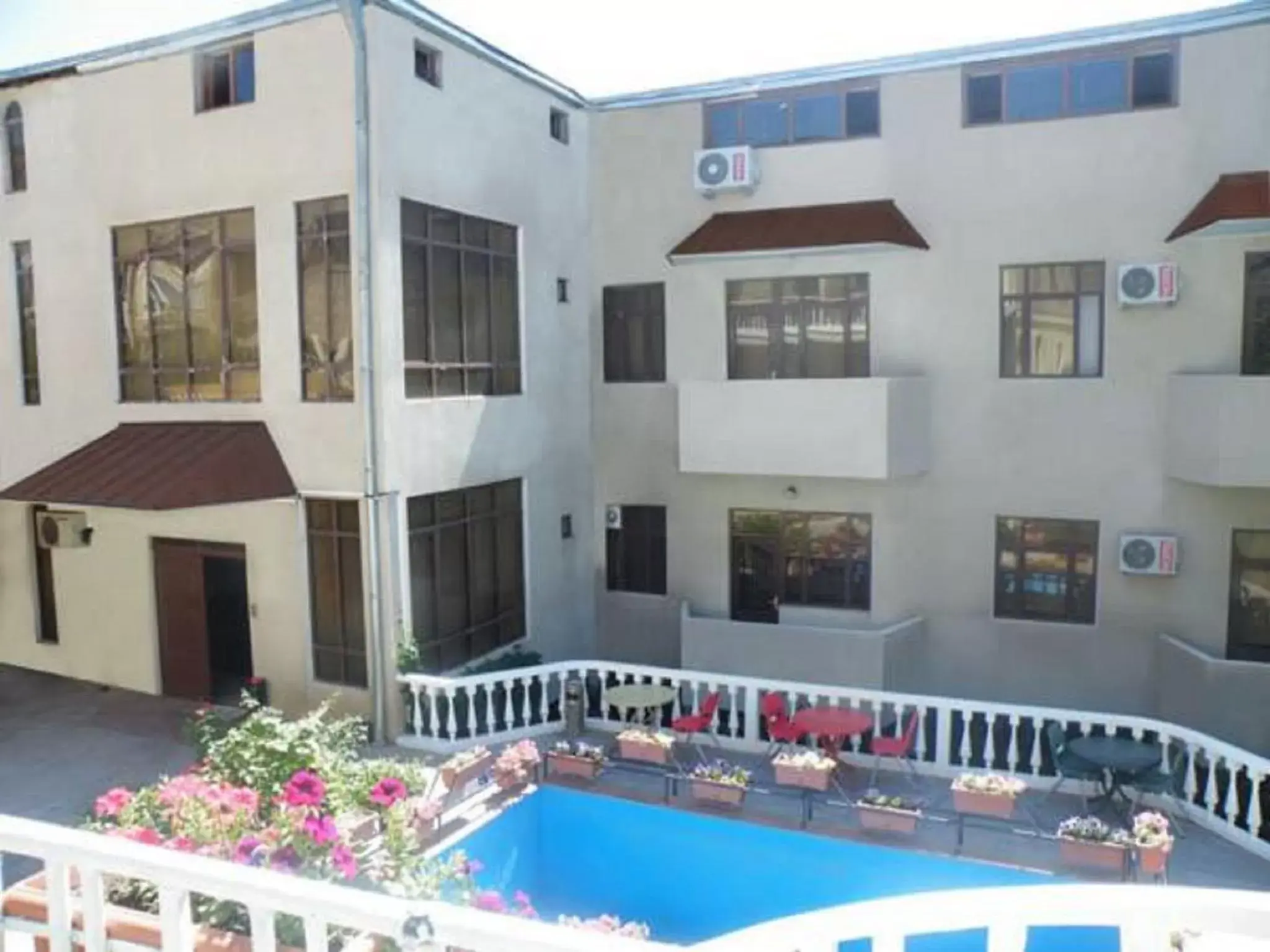 Facade/entrance, Swimming Pool in Capital Hotel