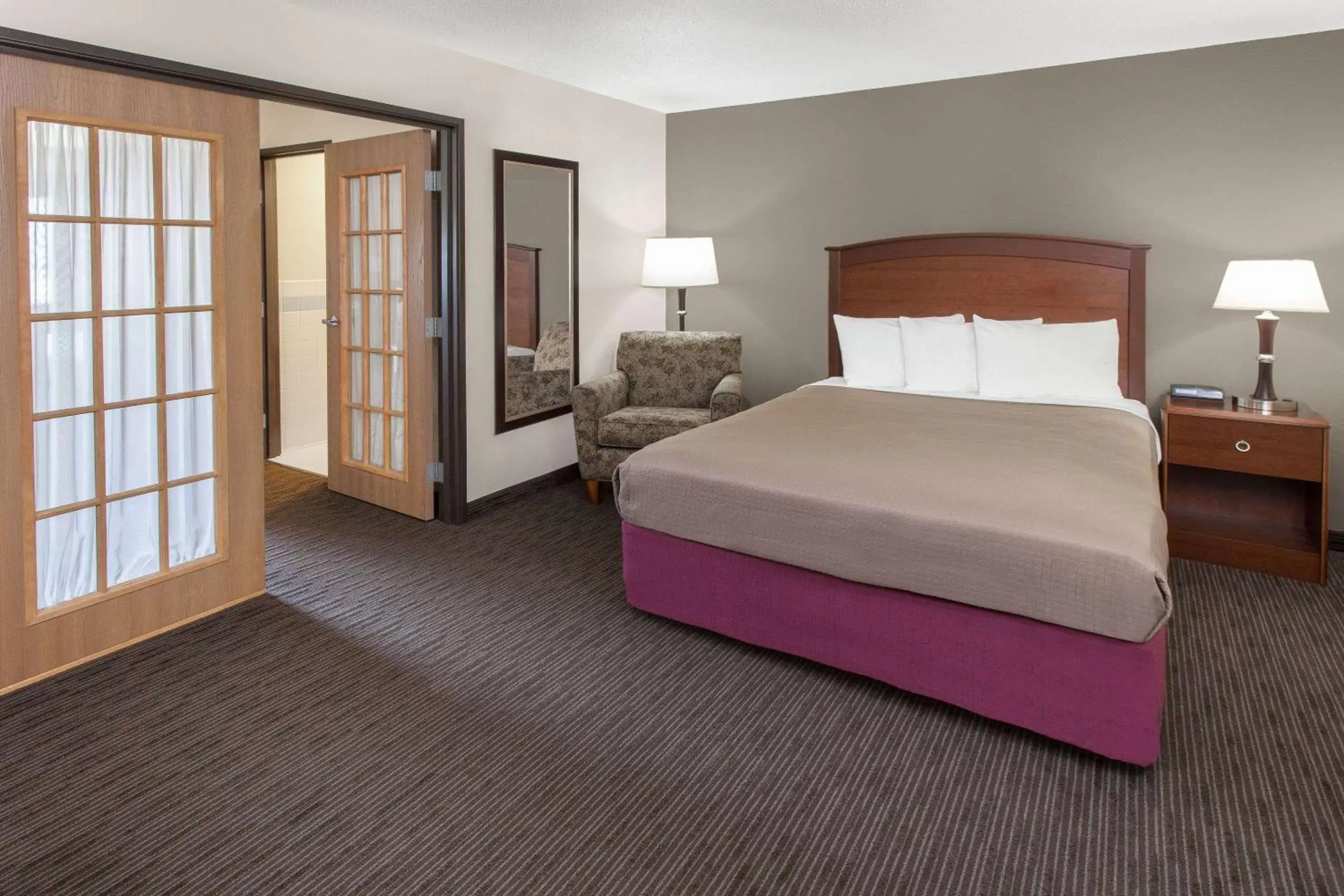 Photo of the whole room, Bed in AmericInn by Wyndham Grundy Center