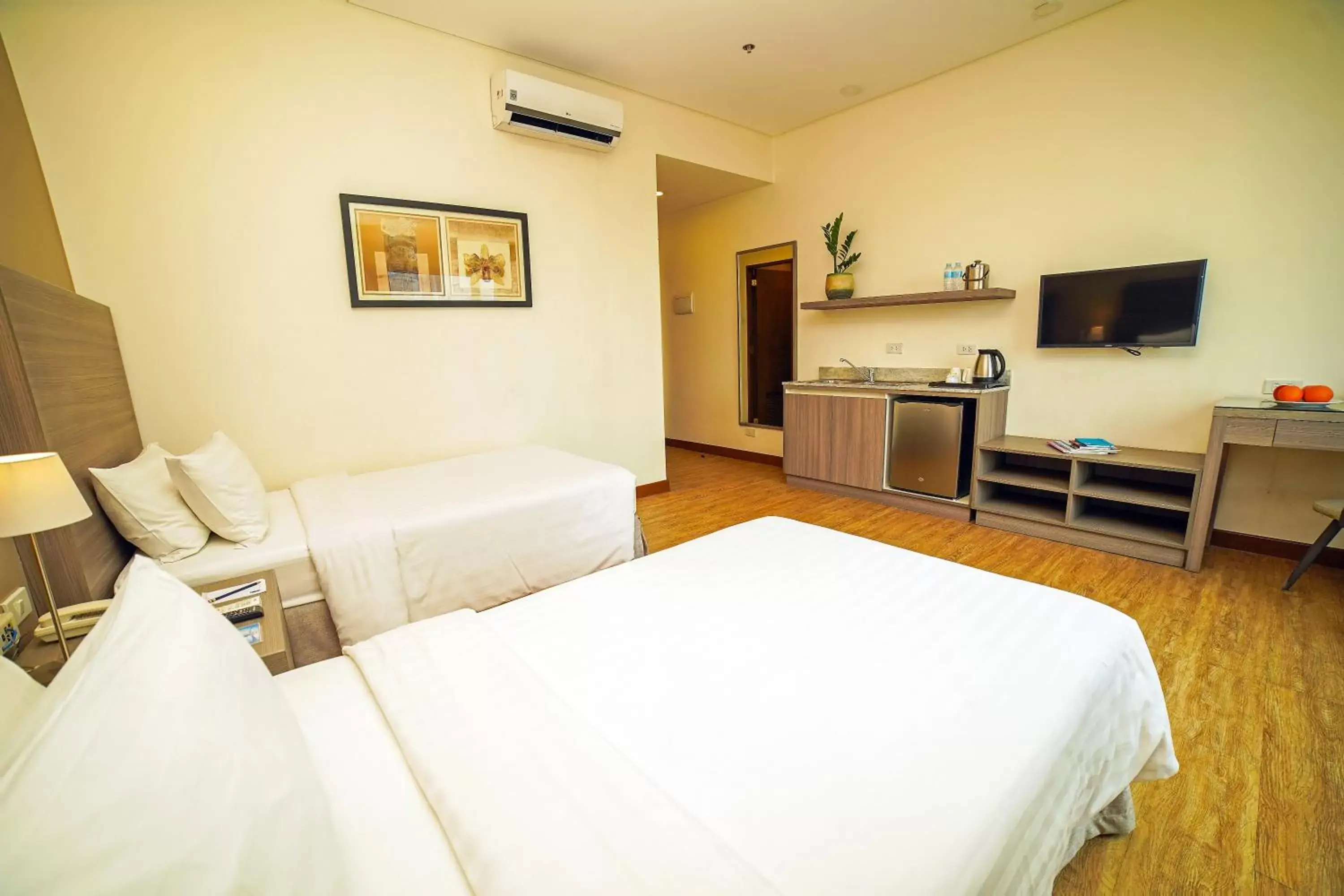 Bedroom, TV/Entertainment Center in One Pacific Place Serviced Residences - Multiple Use Hotel