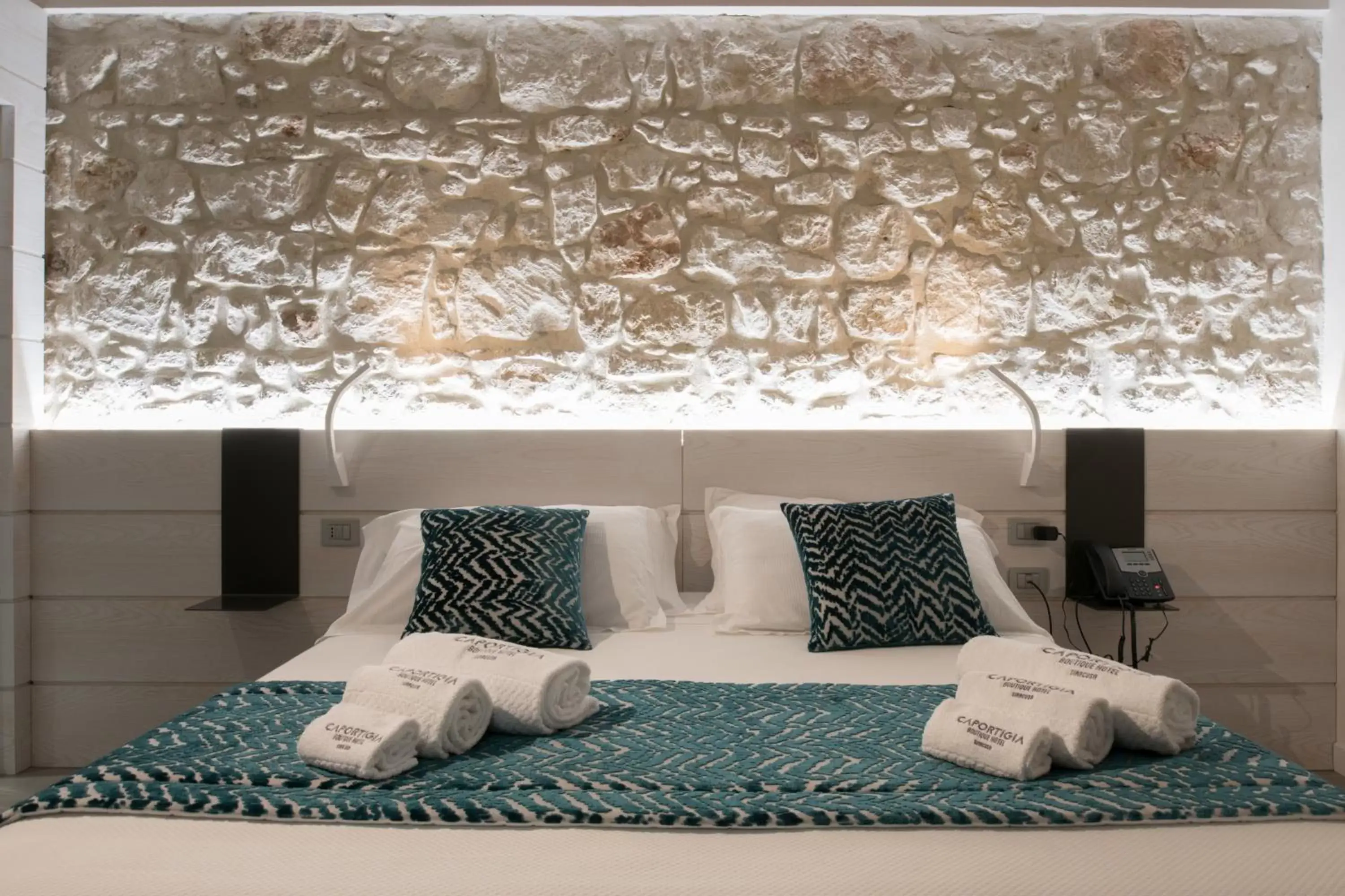 Bed in Caportigia Boutique Hotel