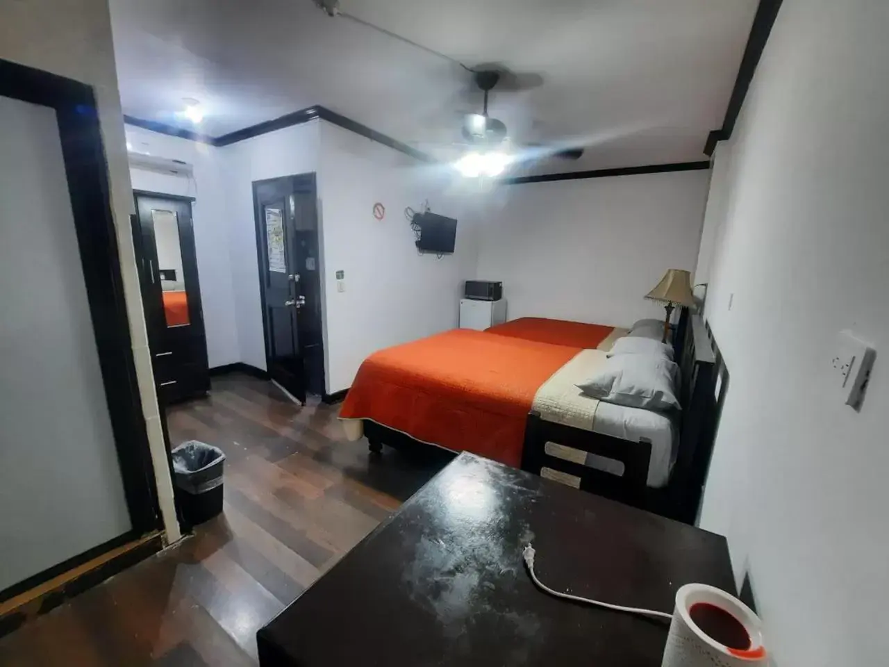 Bed in Garcias Suites y Hotel