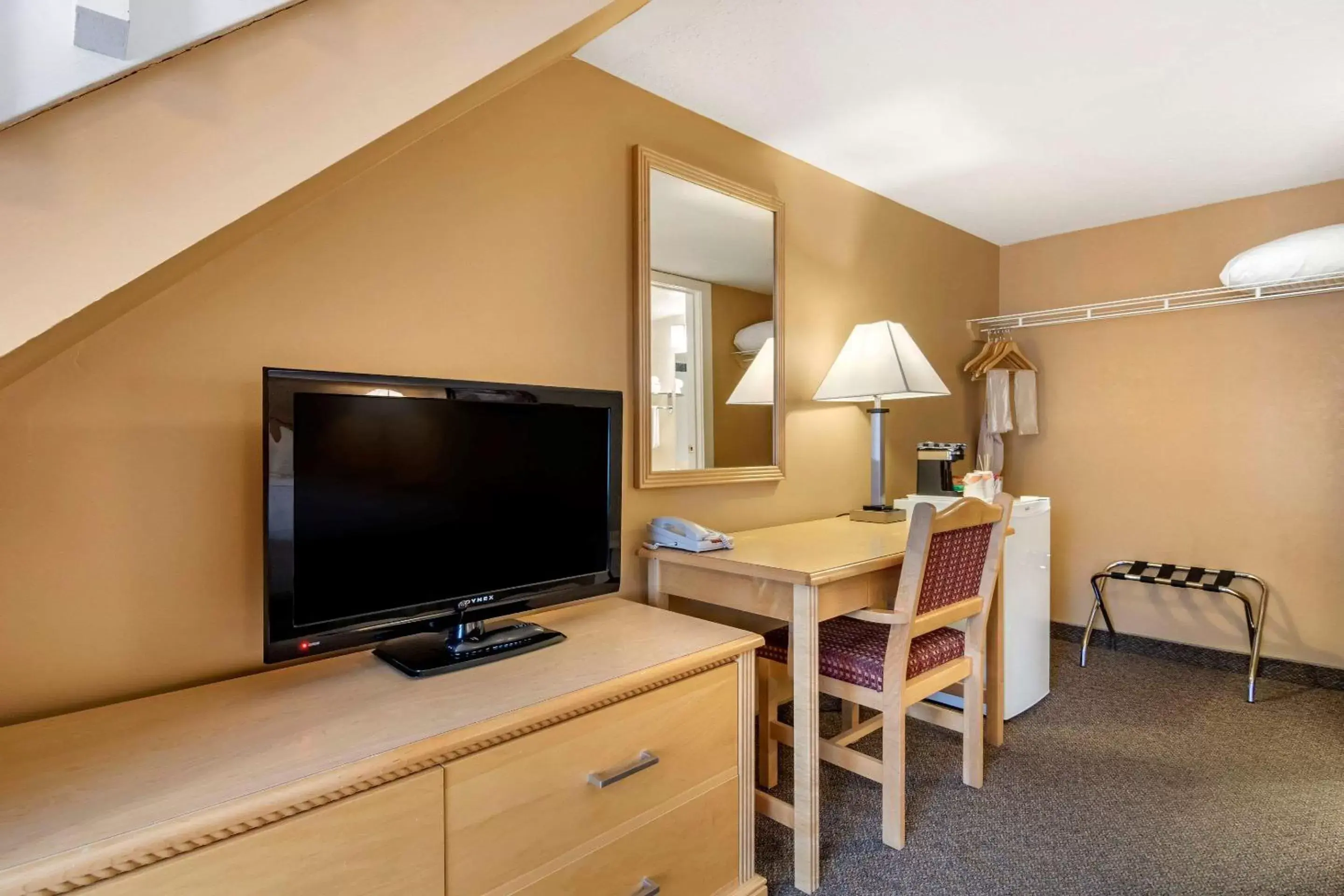 Photo of the whole room, TV/Entertainment Center in Econo Lodge Inn & Suites